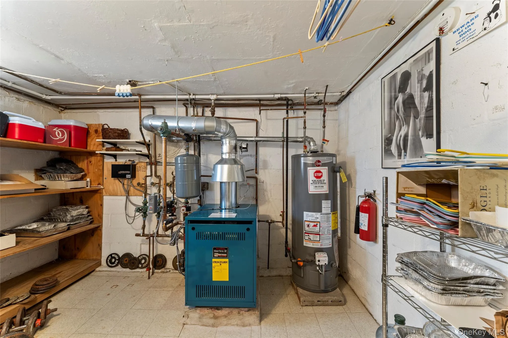 Utility room featuring gas water heater and a heating unit Utility room featuring gas water heater and a heating unit
