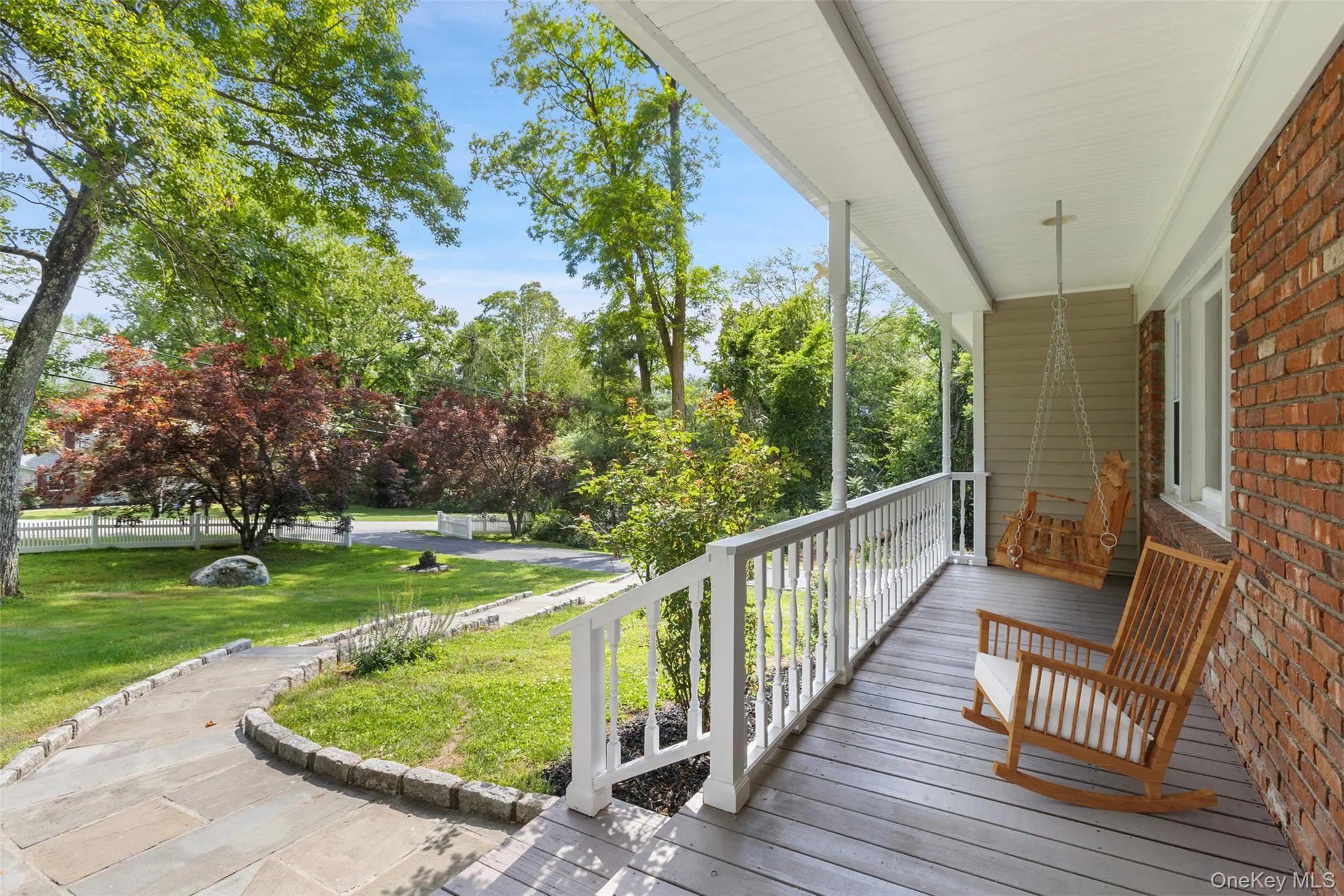 Front Porch virtually staged with large swing and rocking chair Front Porch virtually staged with large swing and rocking chair