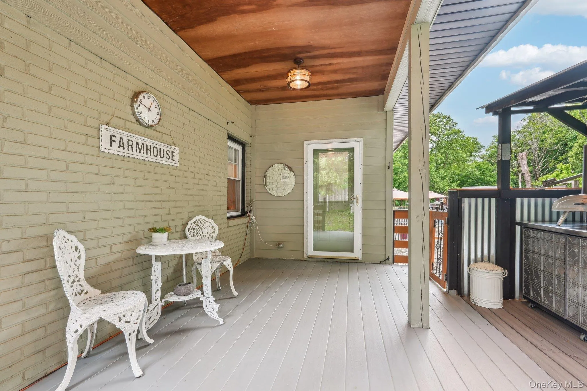 Rear yard deck off mudroom with pizza oven Rear yard deck off mudroom with pizza oven