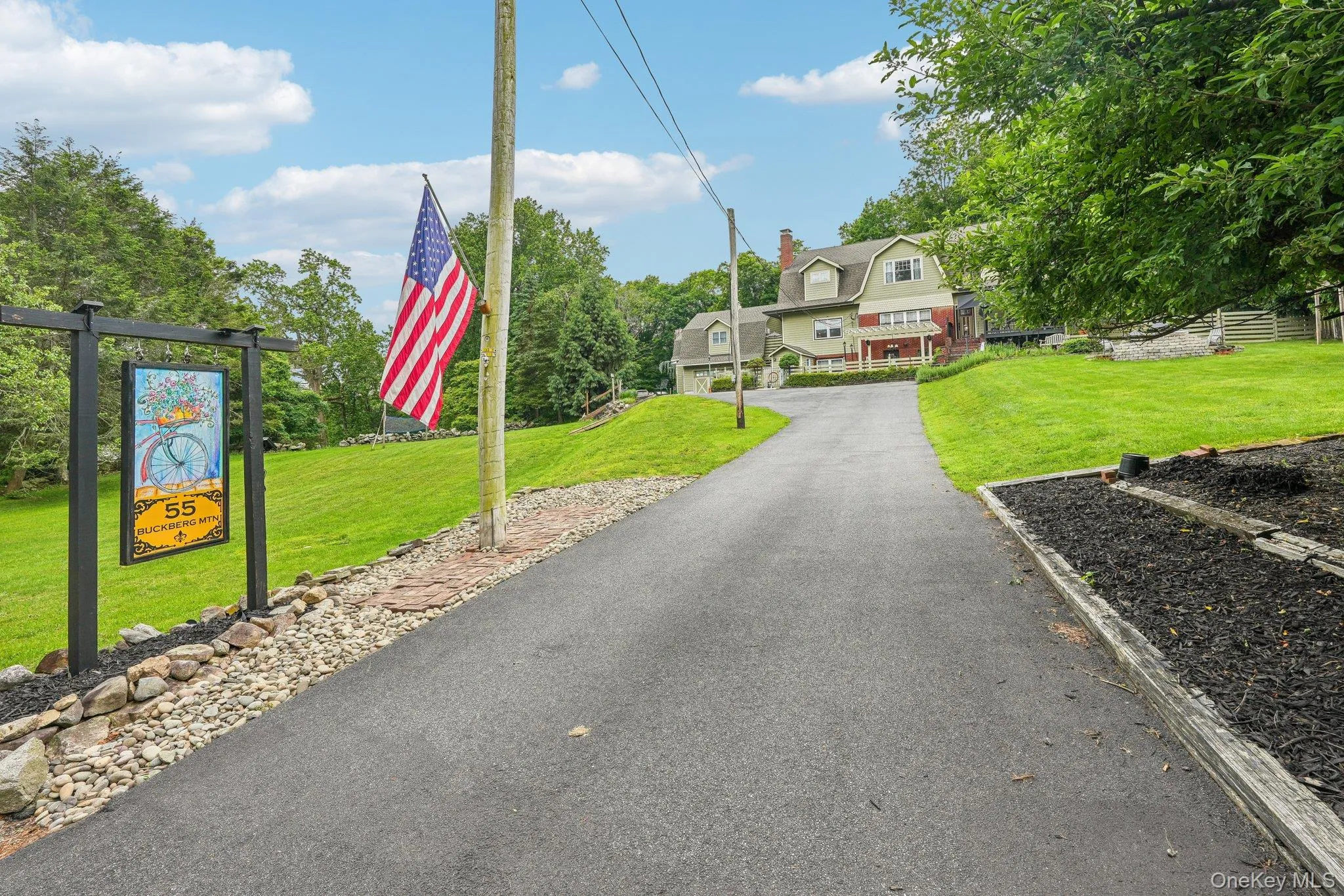 Driveway with ample parking in front, rear and side plus garage Driveway with ample parking in front, rear and side plus garage