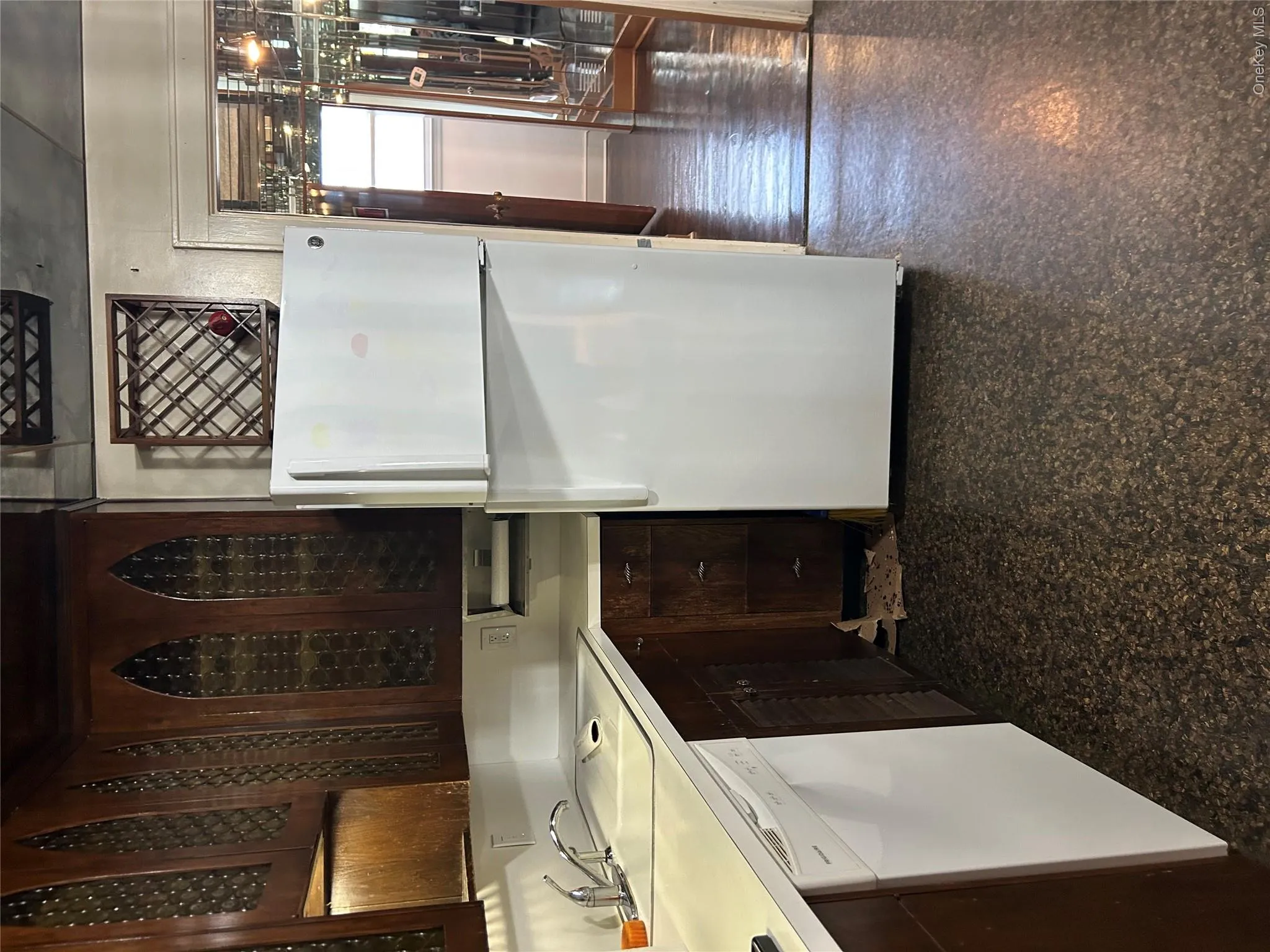 Refrigerator/freezer, dishwasher and tons of cabinets in beautiful wood finish Refrigerator/freezer, dishwasher and tons of cabinets in beautiful wood finish