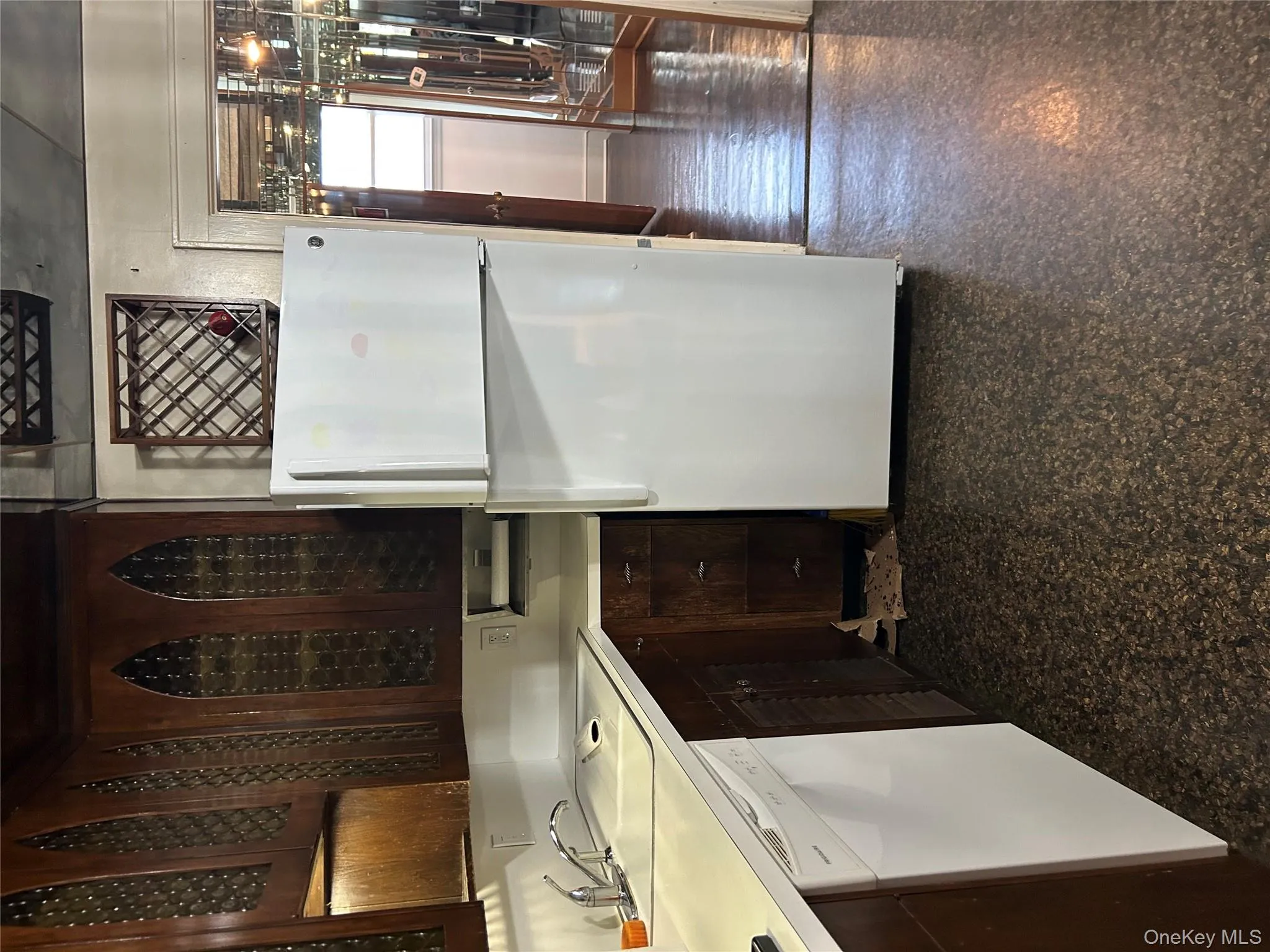 Refrigerator/freezer, dishwasher and tons of cabinets in beautiful wood finish Refrigerator/freezer, dishwasher and tons of cabinets in beautiful wood finish