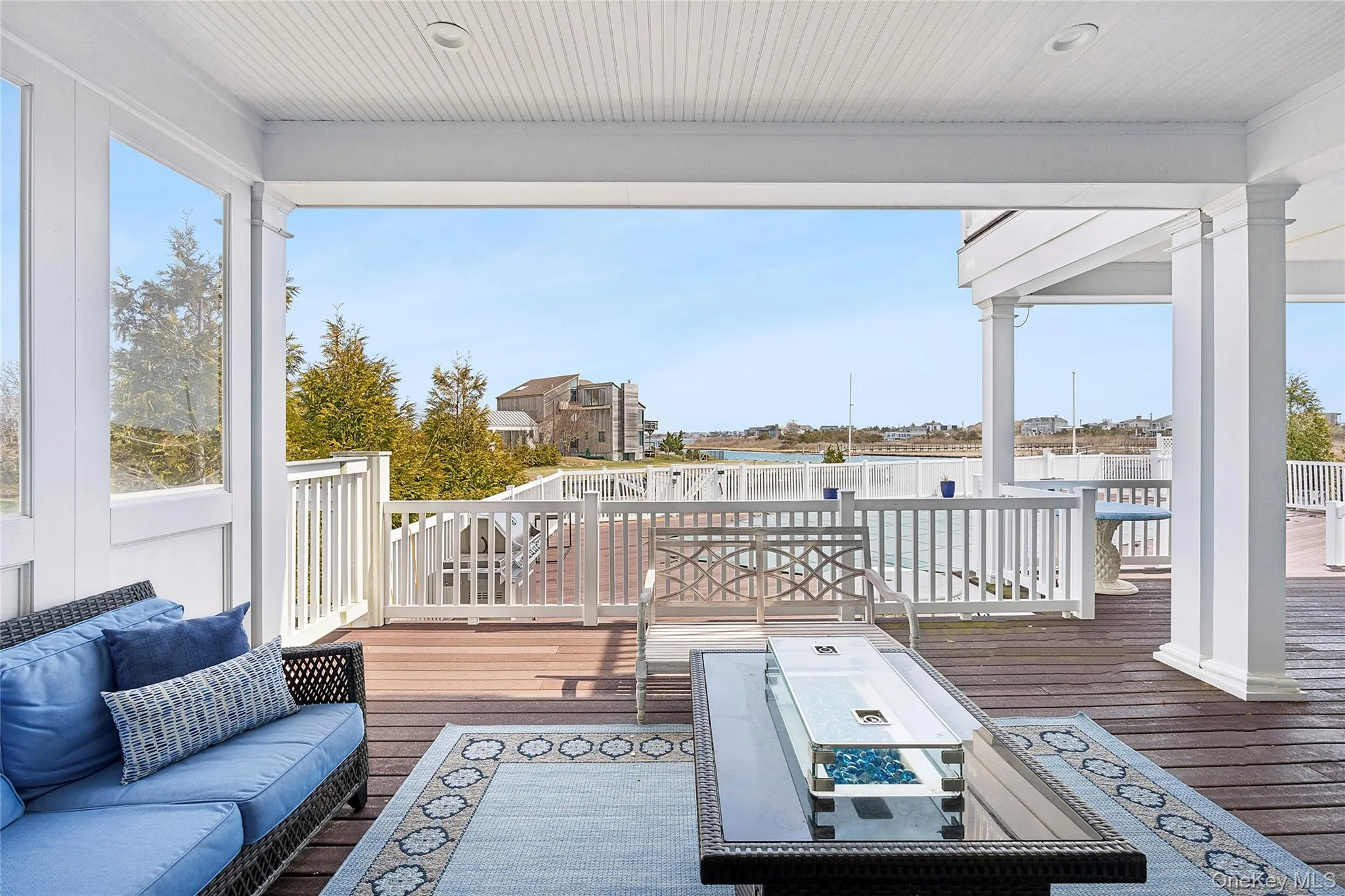 Covered Backyard Deck with Seating and Gas Fireplace Covered Backyard Deck with Seating and Gas Fireplace