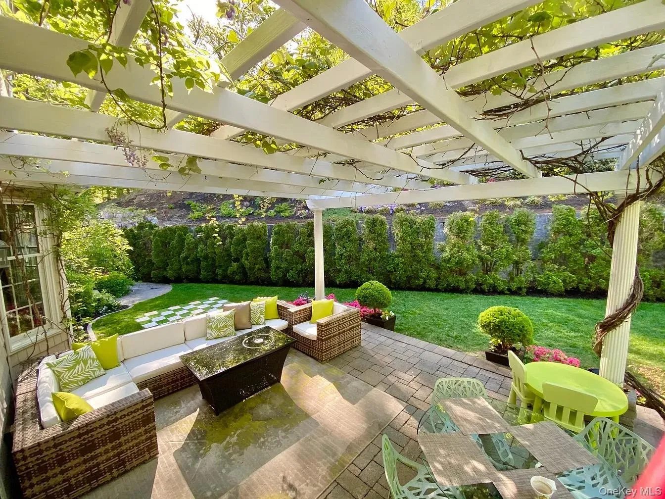 Pergola is off the kitchen and family room. Ideal for relaxation and entertaining Pergola is off the kitchen and family room. Ideal for relaxation and entertaining