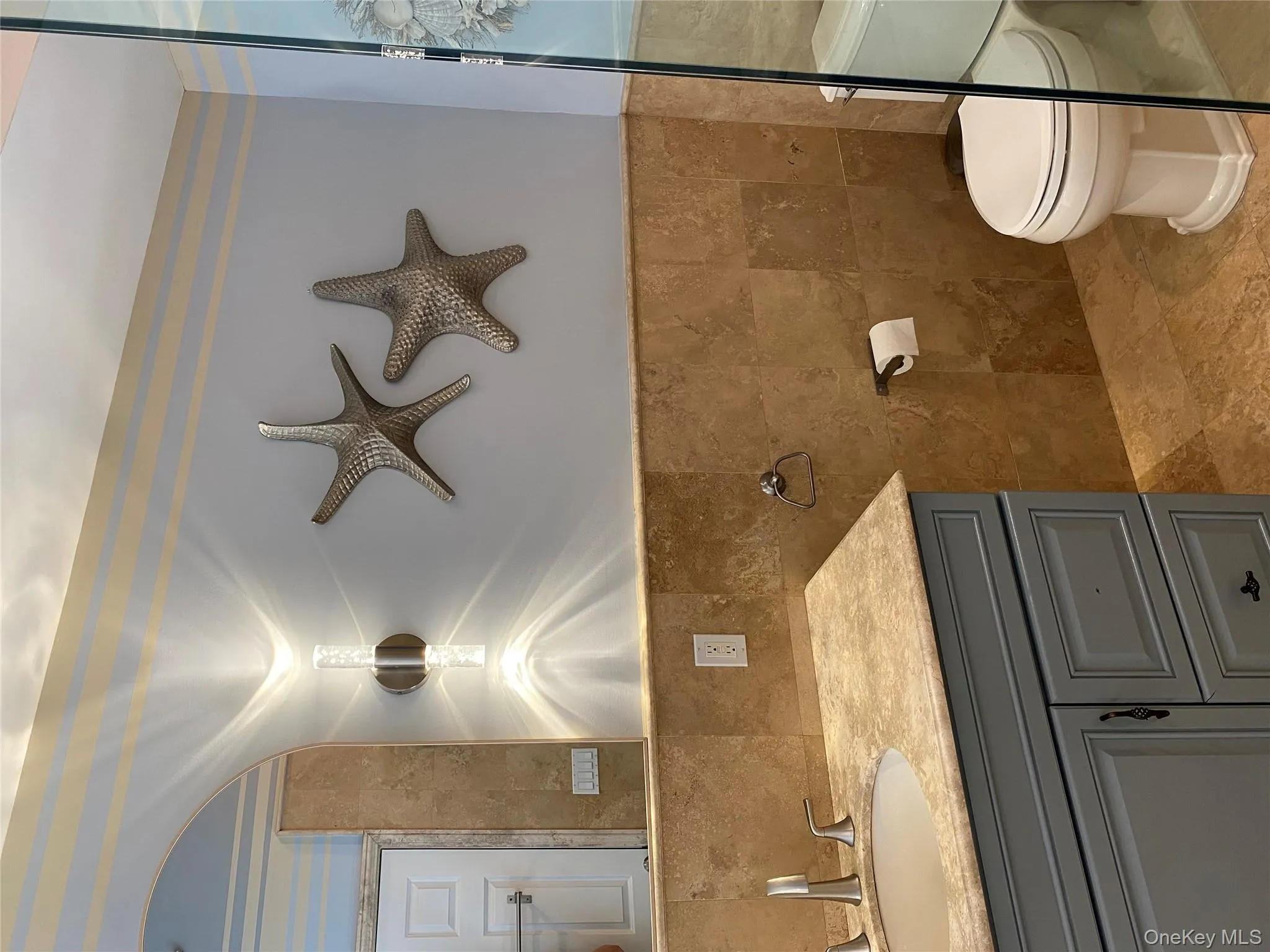 Primary bathroom all tiled in travertine marble Primary bathroom all tiled in travertine marble