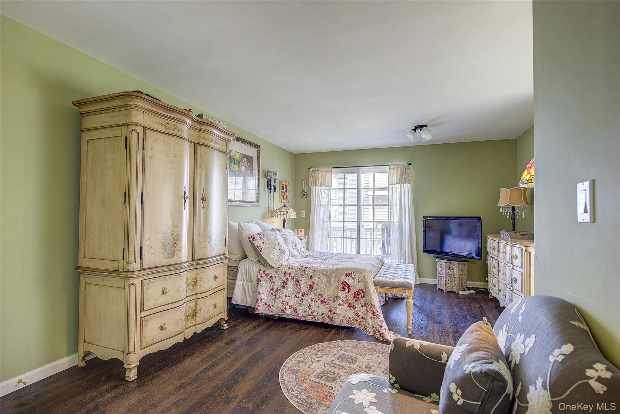 Bedroom with dark wood-style floors Bedroom with dark wood-style floors