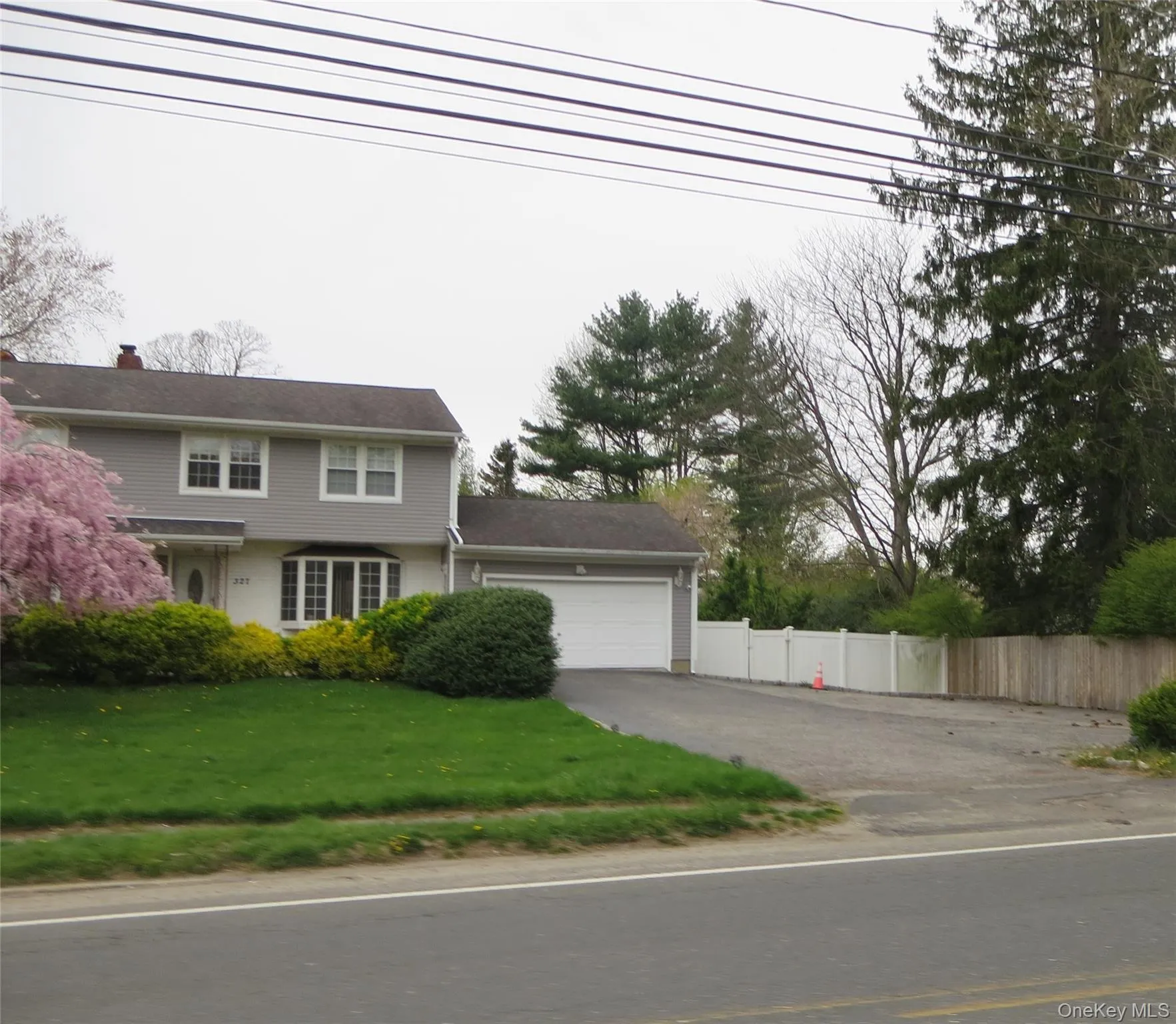 Oversized driveway. Plenty of off street parking plus 2.5 car garage Oversized driveway. Plenty of off street parking plus 2.5 car garage