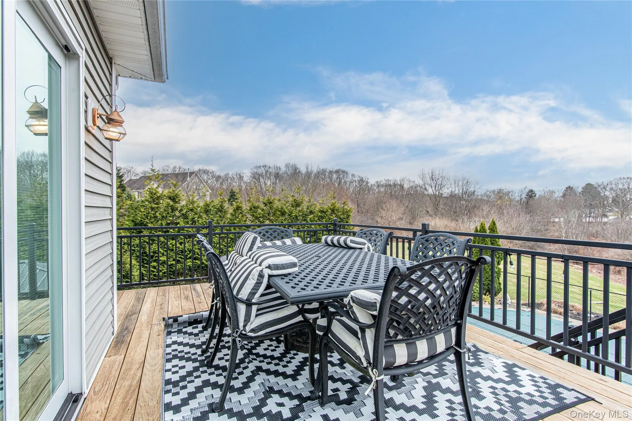Wooden terrace featuring outdoor dining space Wooden terrace featuring outdoor dining space