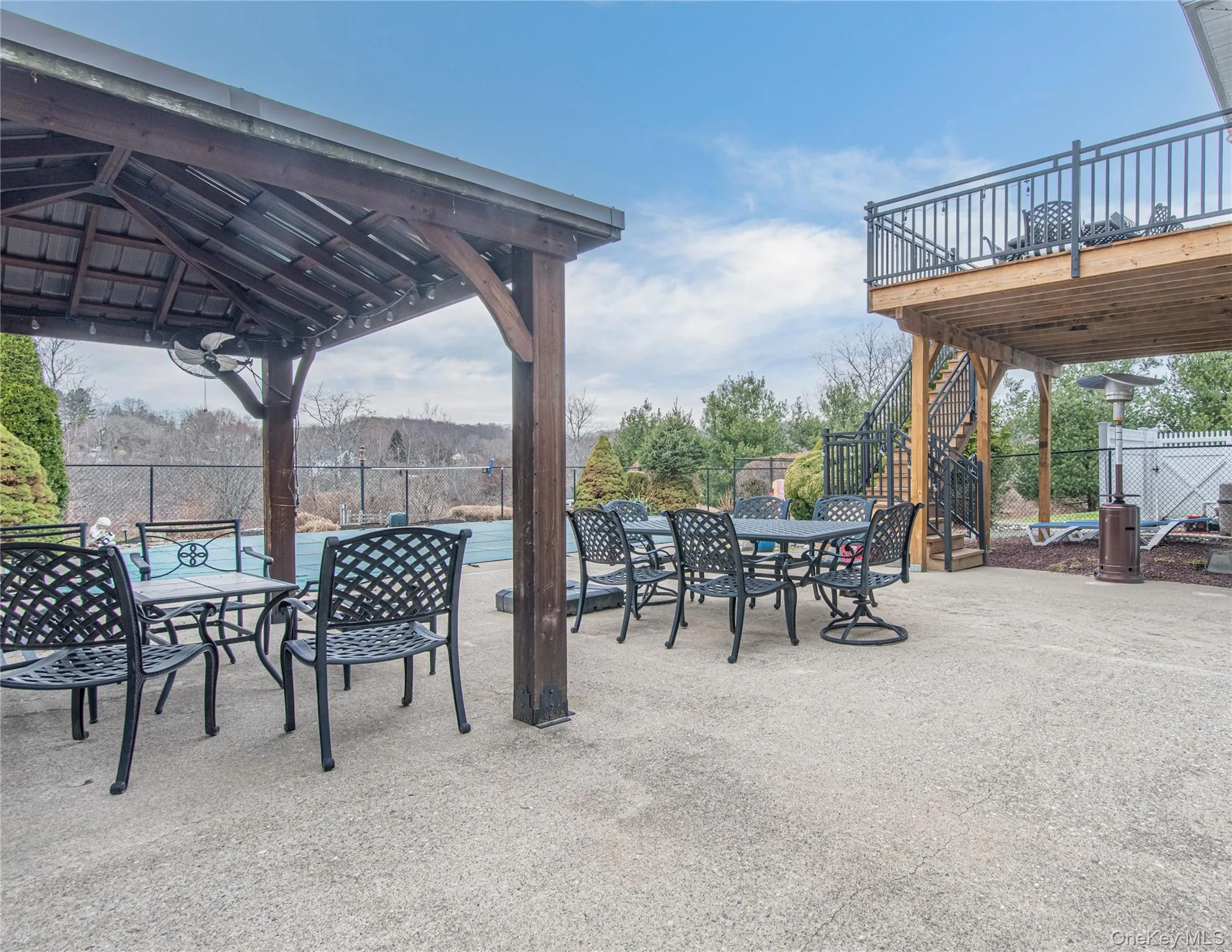 View of patio / terrace with outdoor dining space, a gazebo, and a deck View of patio / terrace with outdoor dining space, a gazebo, and a deck