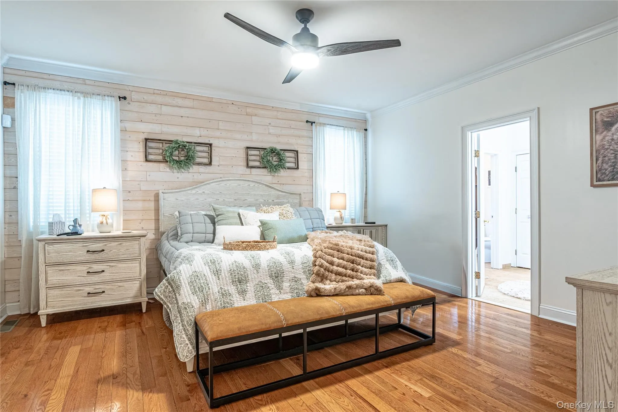 Bedroom with crown molding, wood-type flooring, ceiling fan. Bedroom with crown molding, wood-type flooring, ceiling fan.