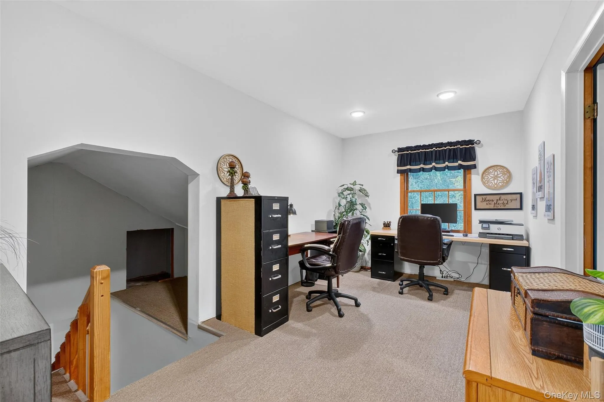 Home office featuring light colored carpet Home office featuring light colored carpet