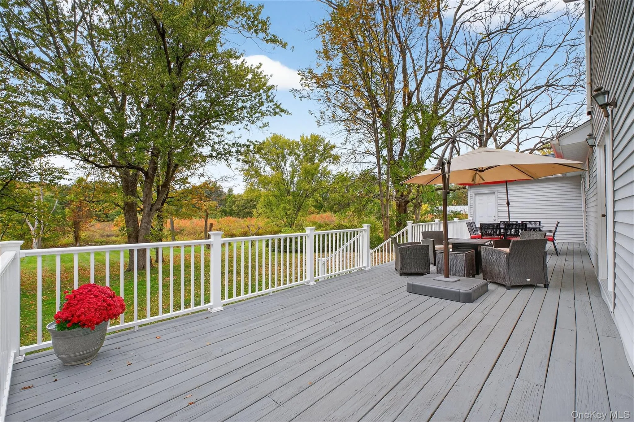 Wooden deck featuring outdoor dining space Wooden deck featuring outdoor dining space