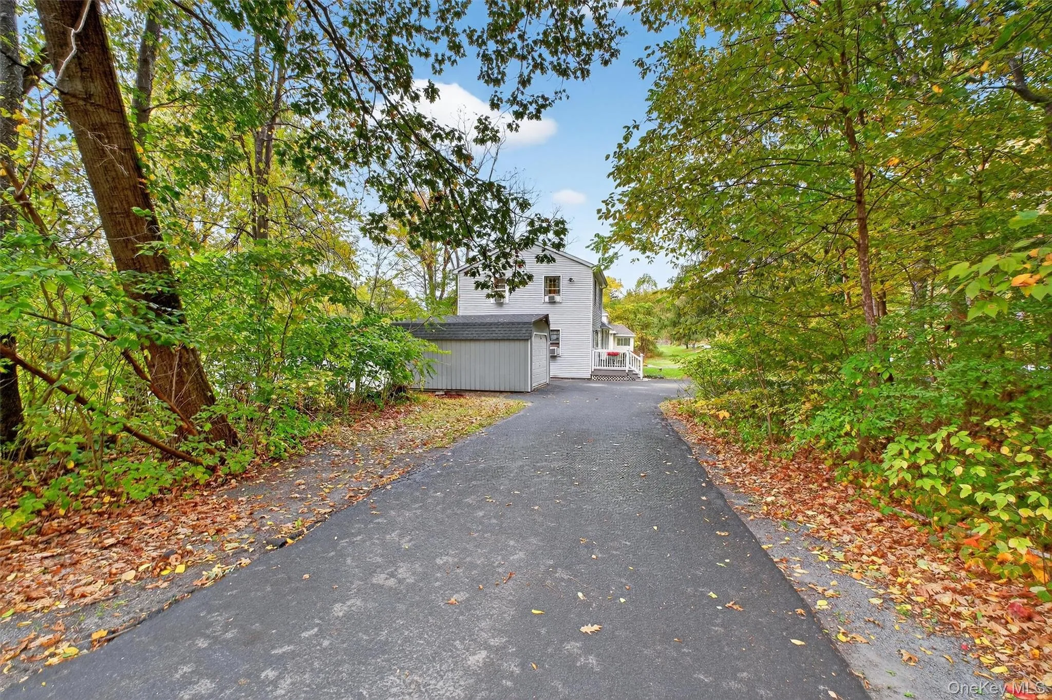 View of front of house with asphalt driveway View of front of house with asphalt driveway