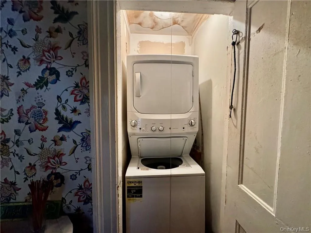 Laundry room with stacked washer and clothes dryer Laundry room with stacked washer and clothes dryer