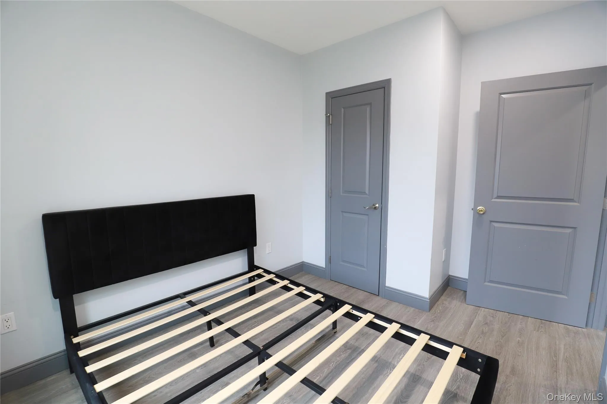 Bedroom with light wood-style floors and baseboards Bedroom with light wood-style floors and baseboards