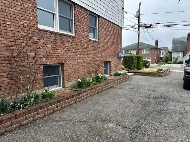 View of home's exterior featuring brick siding View of home's exterior featuring brick siding