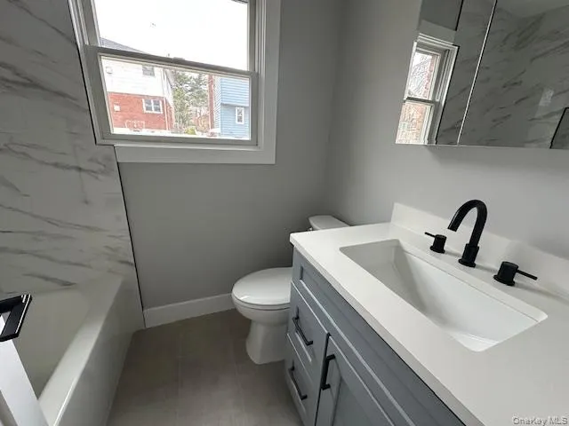 Full bathroom with vanity and toilet Full bathroom with vanity and toilet