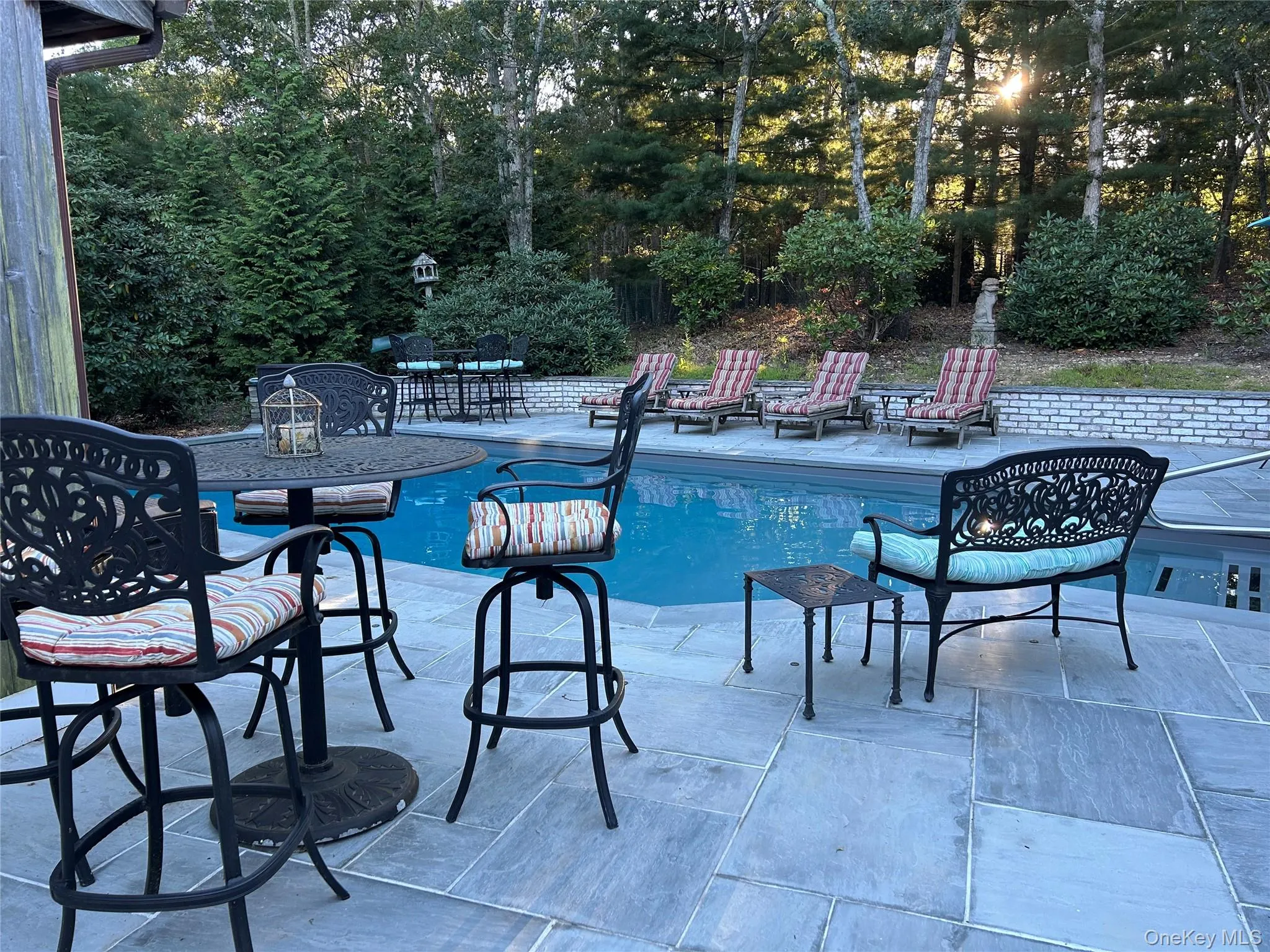 Swimming pool featuring a patio area Swimming pool featuring a patio area