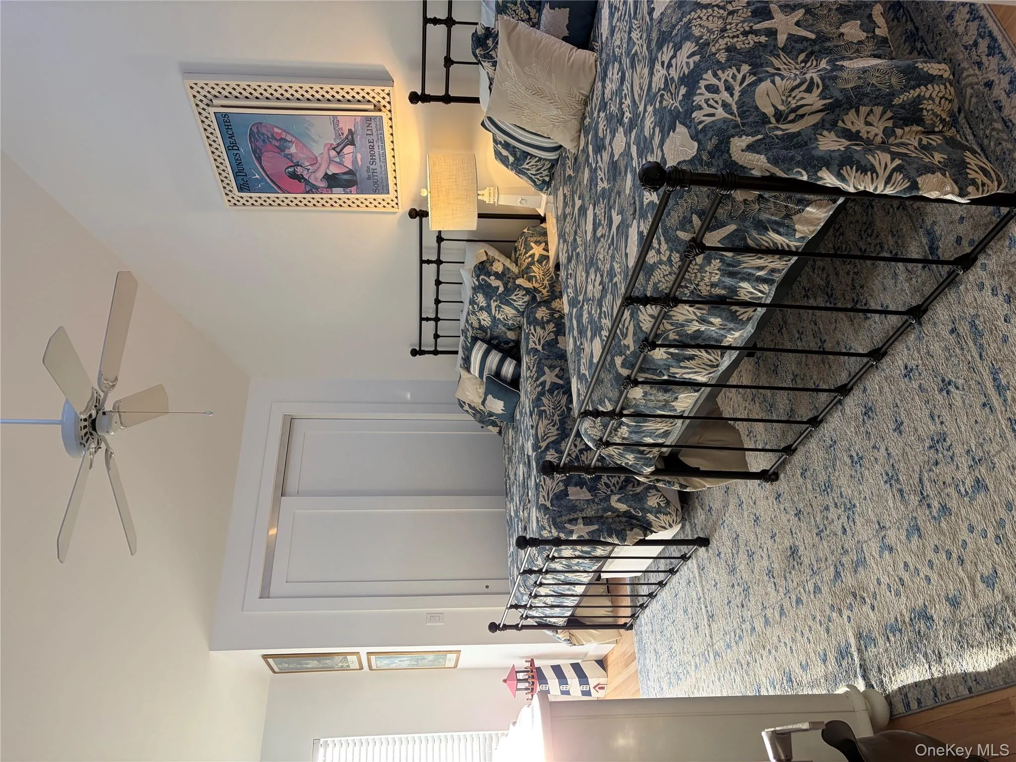 Bedroom featuring light wood-style flooring, lofted ceiling, a closet, and ceiling fan Bedroom featuring light wood-style flooring, lofted ceiling, a closet, and ceiling fan