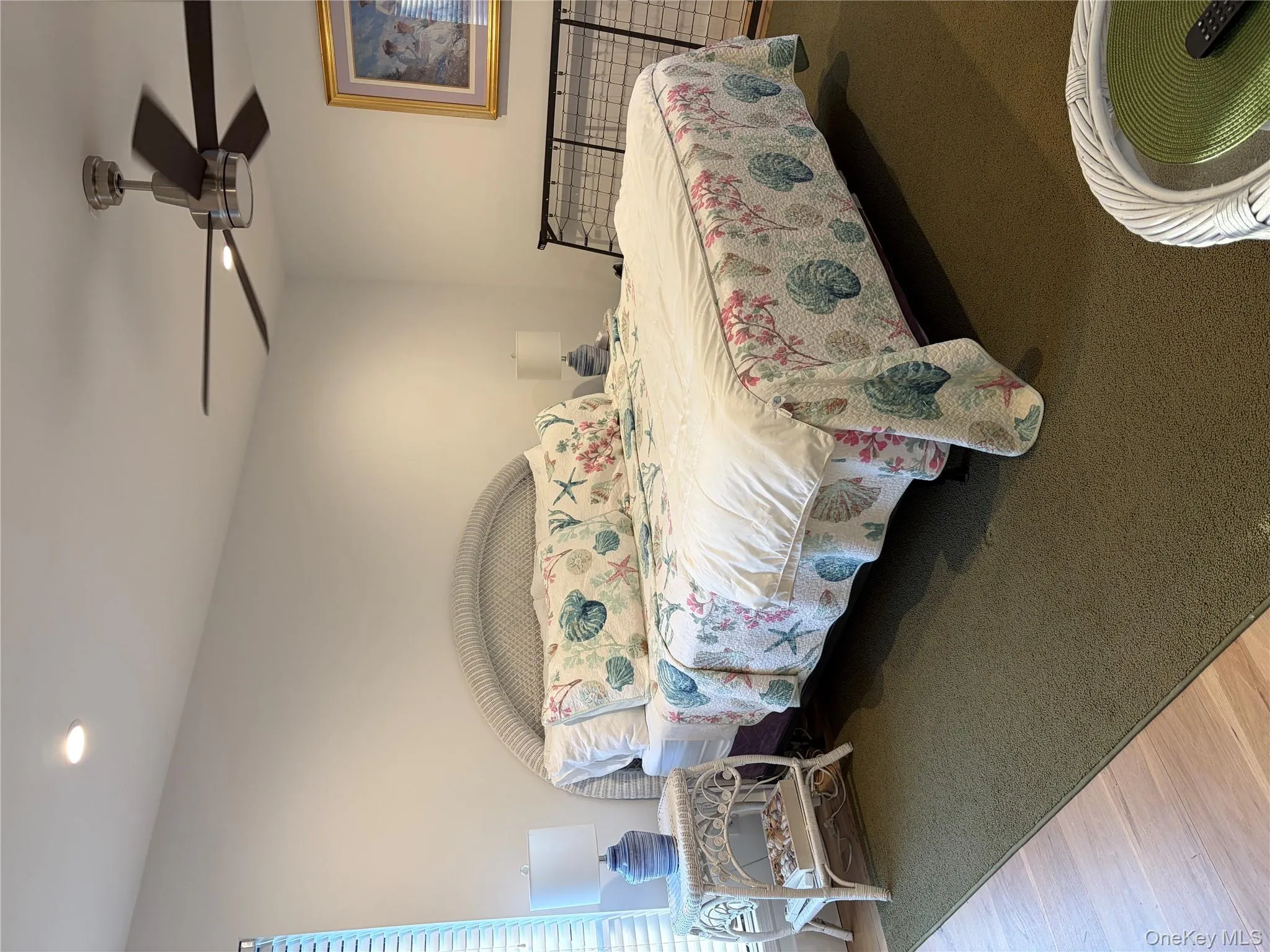 Bedroom featuring wood finished floors, a ceiling fan, and recessed lighting Bedroom featuring wood finished floors, a ceiling fan, and recessed lighting