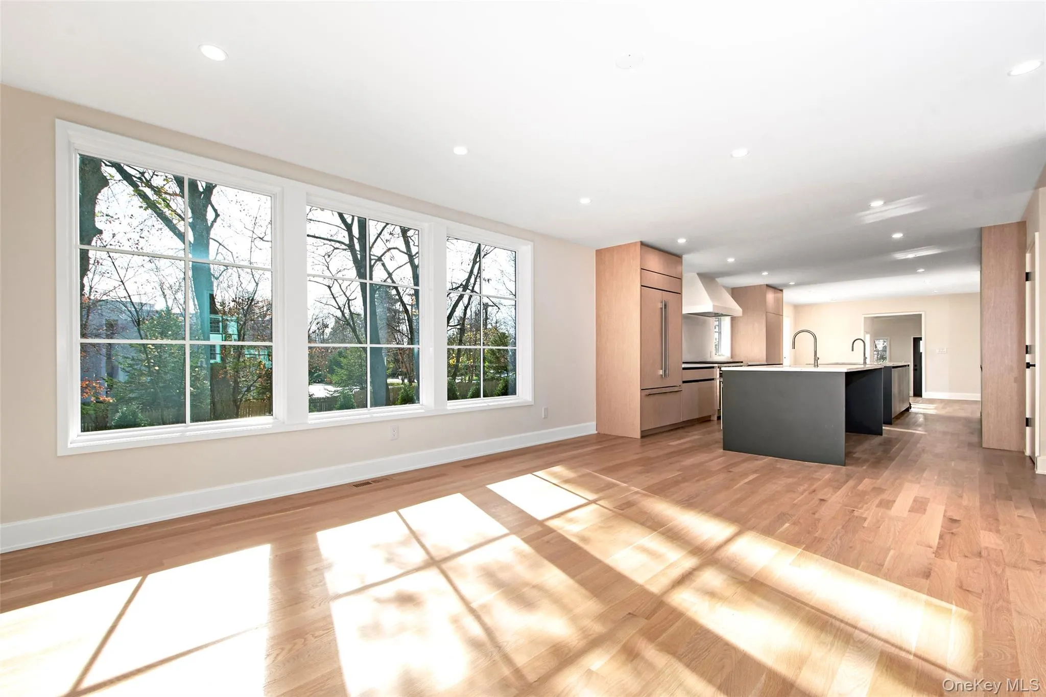 Family room off of kitchen with oversize Pella windows. Family room off of kitchen with oversize Pella windows.