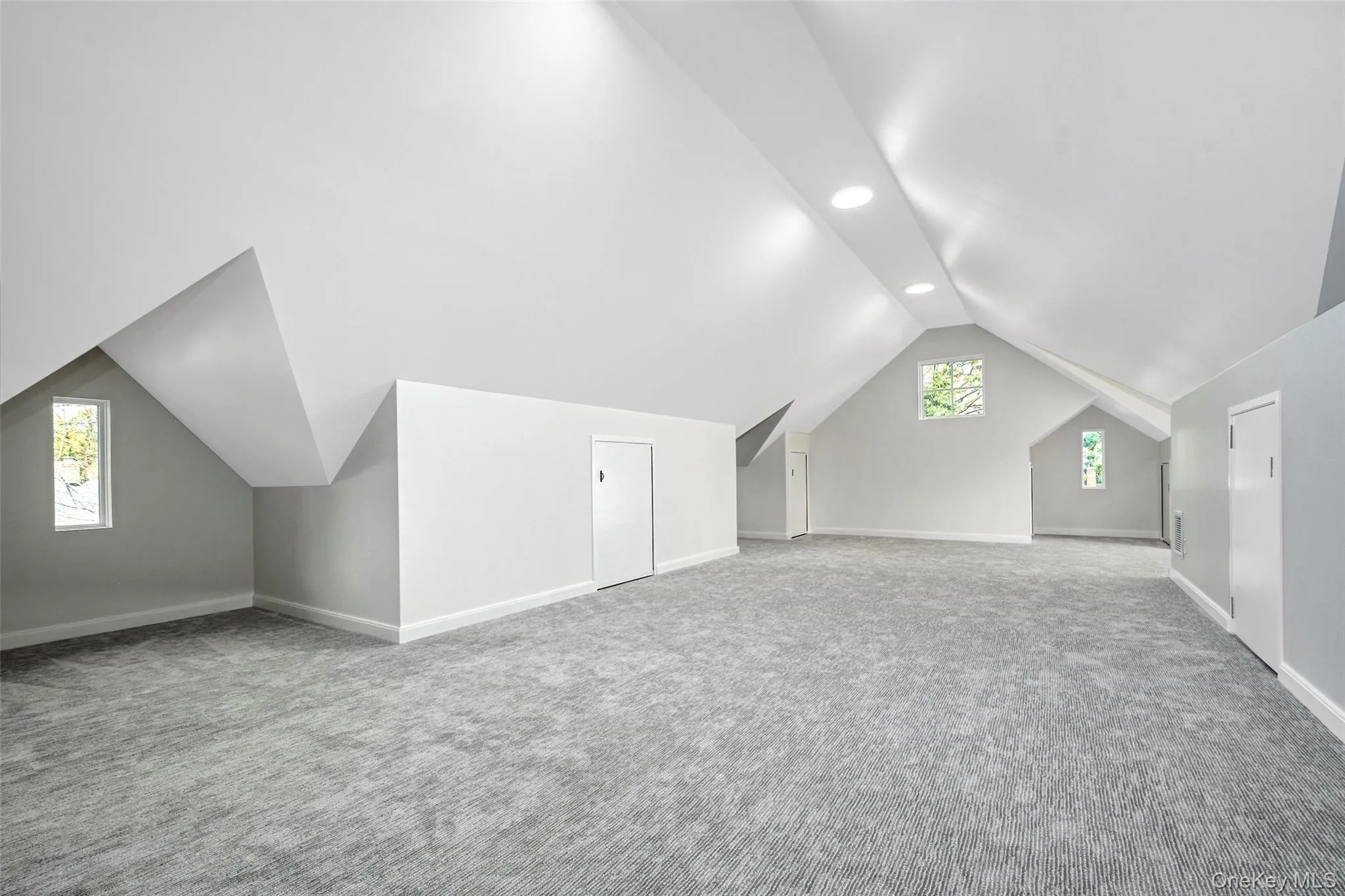 3rd floor Bonus Room with carpeting and 10ft cathedral ceilings and storage. 3rd floor Bonus Room with carpeting and 10ft cathedral ceilings and storage.