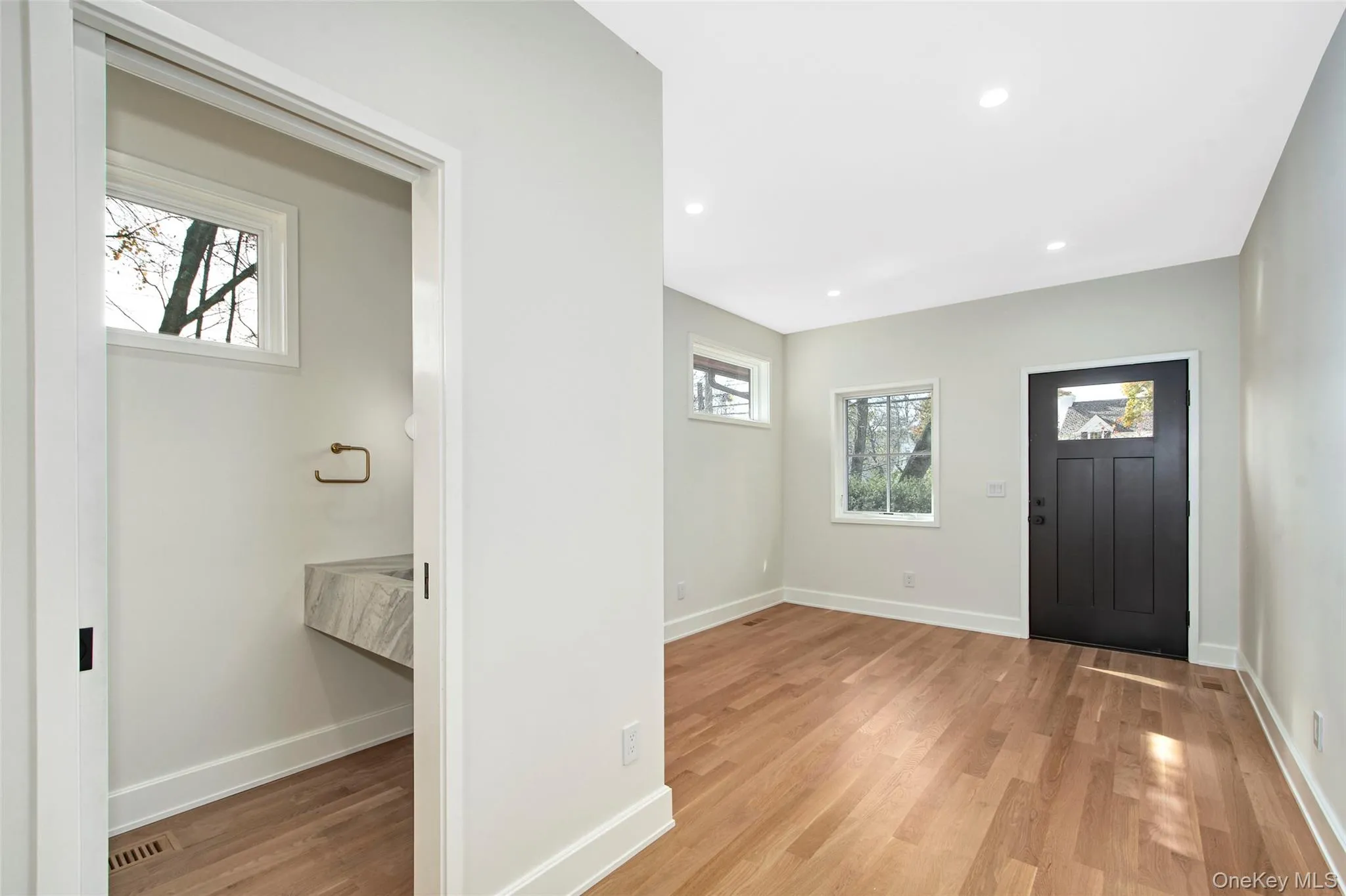 Mud room with separate entrance and doors to 2 car garage. Mud room with separate entrance and doors to 2 car garage.