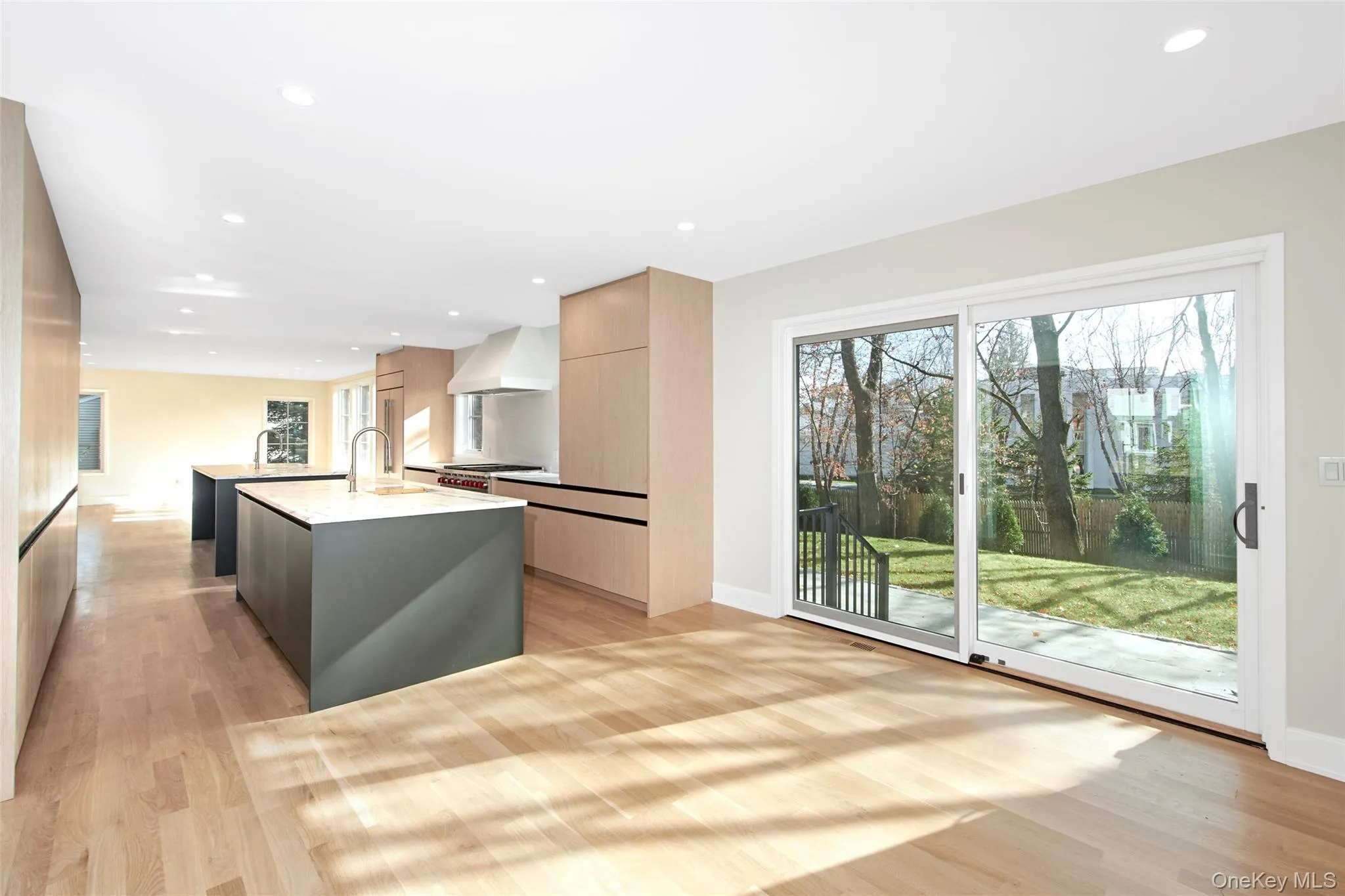 Another view of the kitchen with sliding. glass door opening to the backyard. Another view of the kitchen with sliding. glass door opening to the backyard.