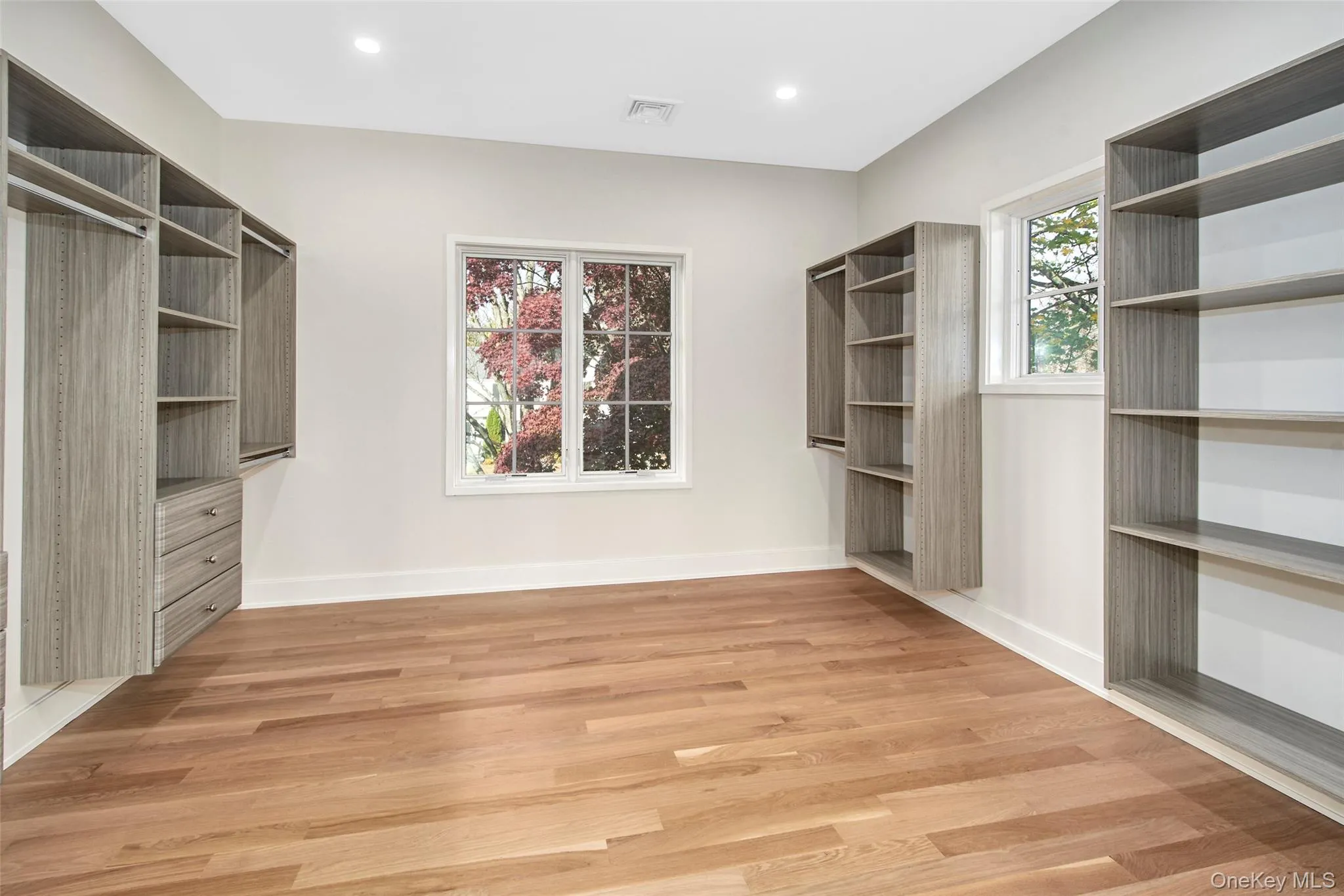 Walk in closet in primary bedroom. Walk in closet in primary bedroom.