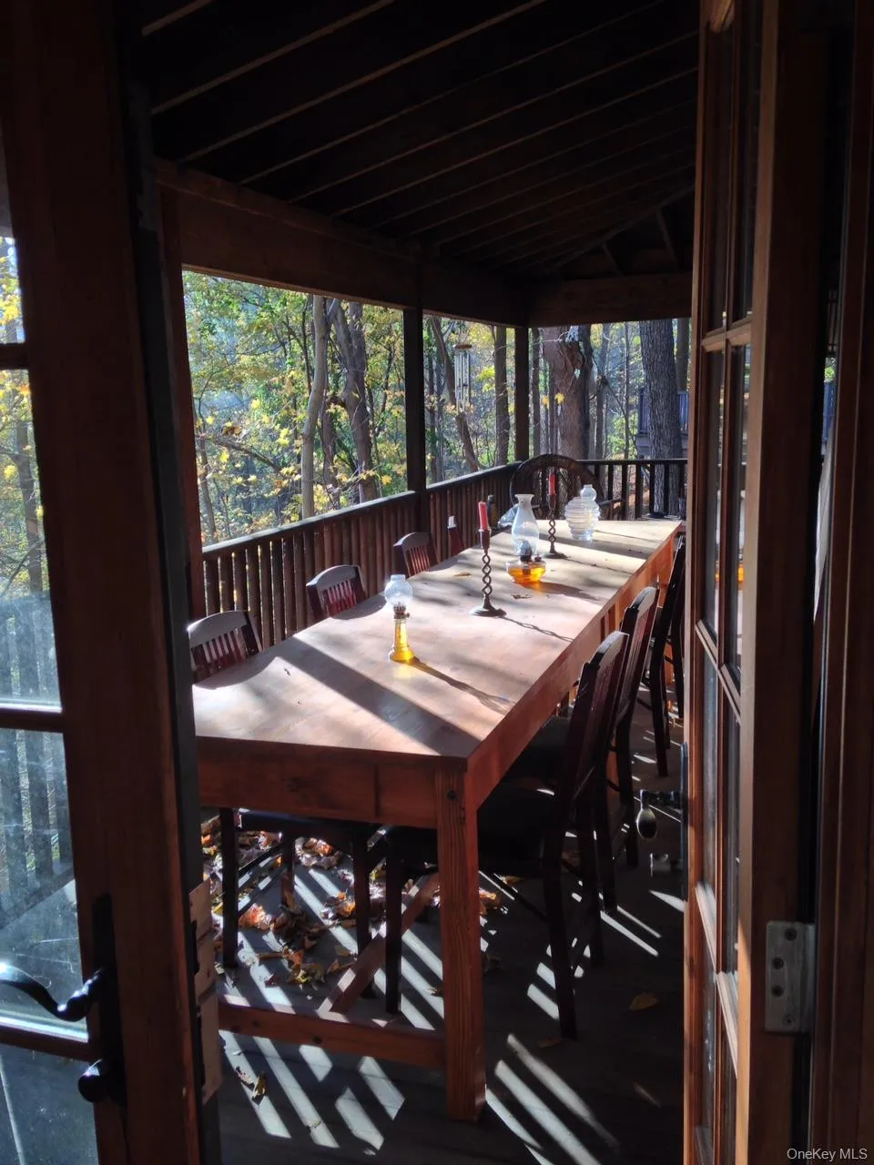 Mahogany porch with roof overlooking the woods and stream Mahogany porch with roof overlooking the woods and stream