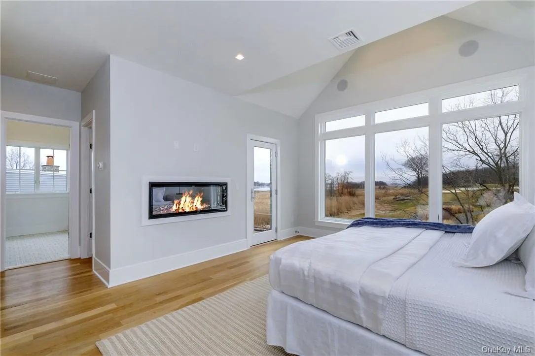 Primary Bedroom w/ fireplace & deck Primary Bedroom w/ fireplace & deck
