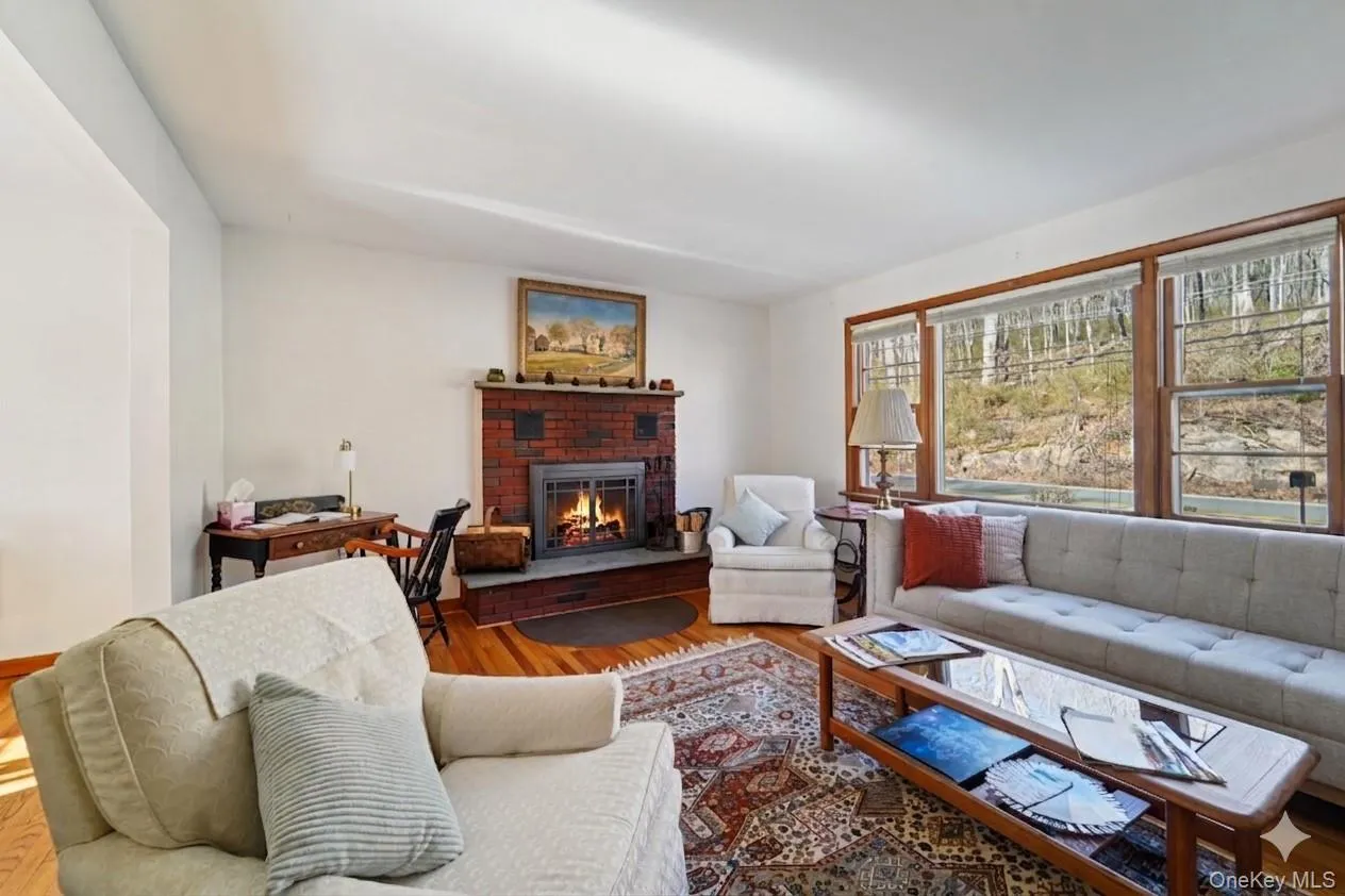 Living room with wood-burning fireplace. Living room with wood-burning fireplace.
