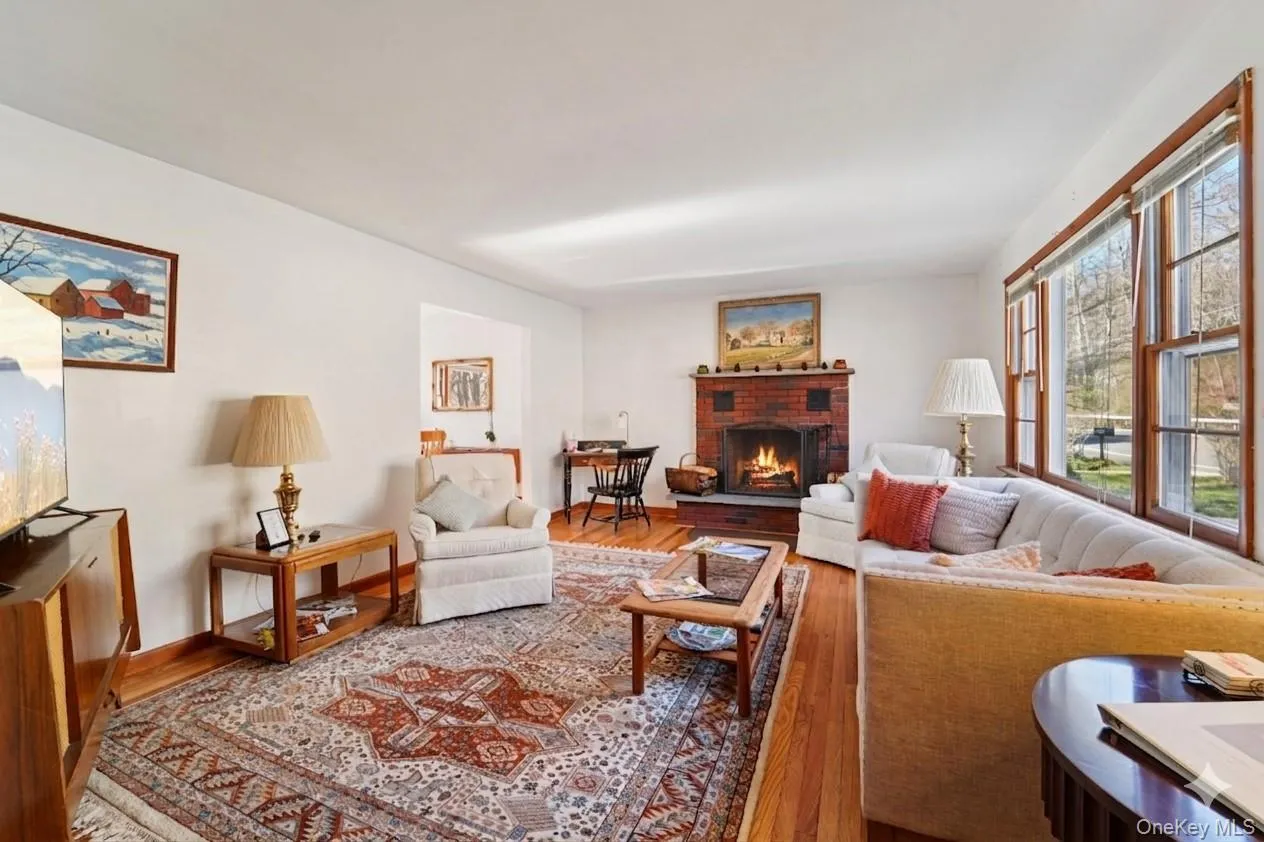 Living room with wood-burning fireplace. Living room with wood-burning fireplace.
