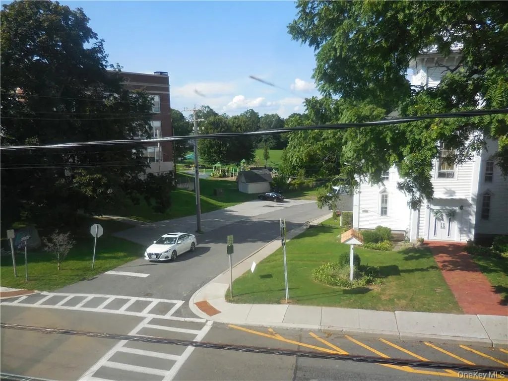 View of home's community featuring a lawn View of home's community featuring a lawn
