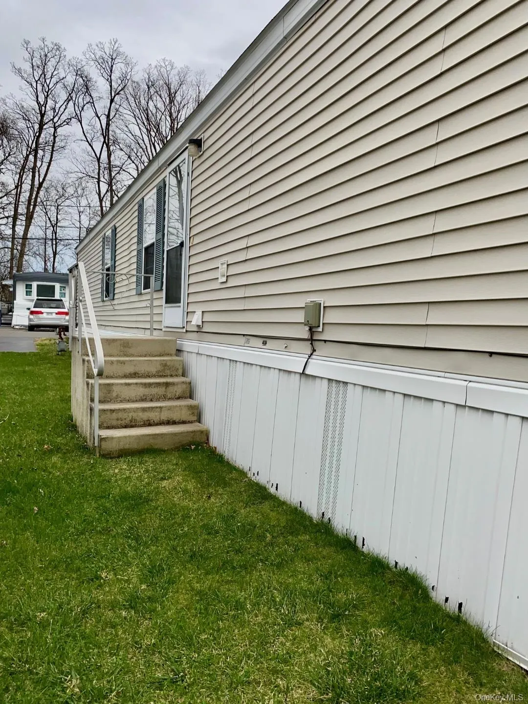 Stairs from the kitchen area which lead to the side yard Stairs from the kitchen area which lead to the side yard