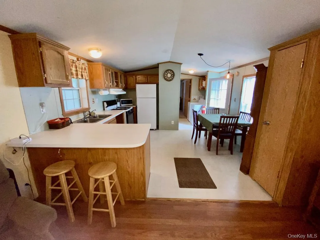 There's a large kitchen with room for a table - lots of oak cabinets, plenty of counterspace and a penninsula. There's a large kitchen with room for a table - lots of oak cabinets, plenty of counterspace and a penninsula.