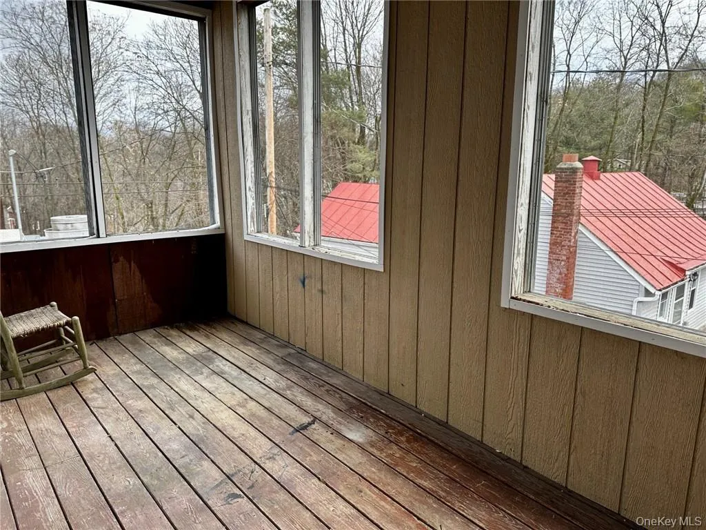 Unfurnished sunroom with a healthy amount of sunlight Unfurnished sunroom with a healthy amount of sunlight
