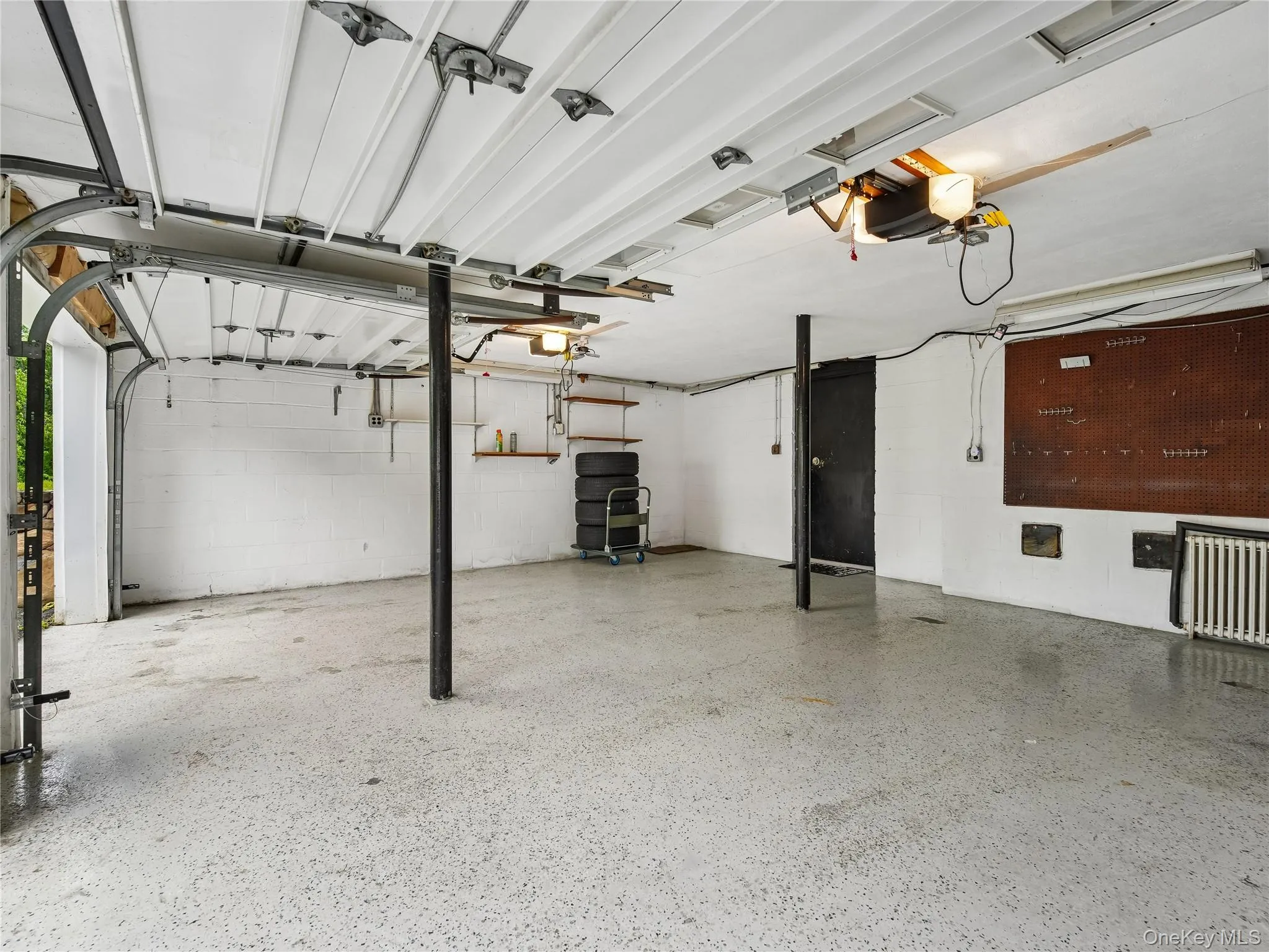 Two-car garage with automatic garage door system. Two-car garage with automatic garage door system.