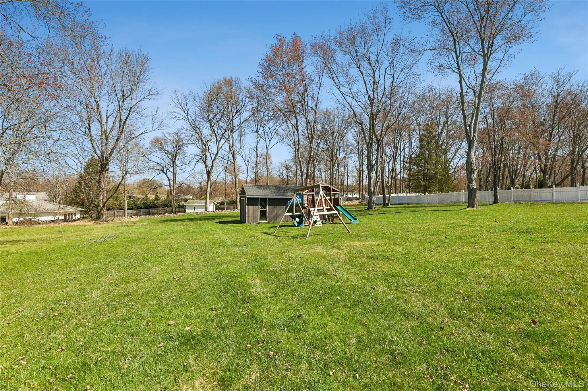 Expansive green lawn providing ample open space and playground. Expansive green lawn providing ample open space and playground.