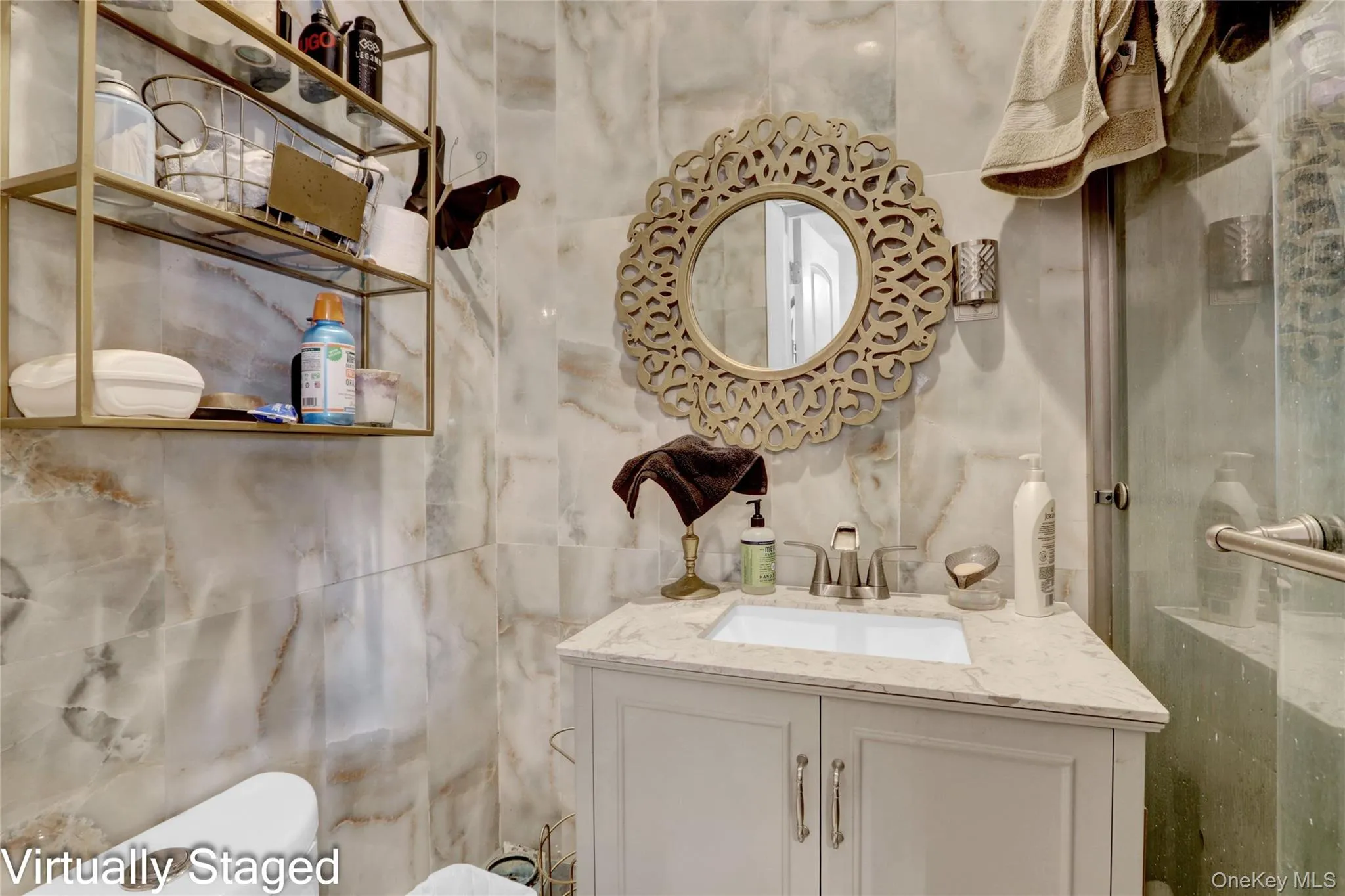 Bathroom featuring vanity and toilet Bathroom featuring vanity and toilet