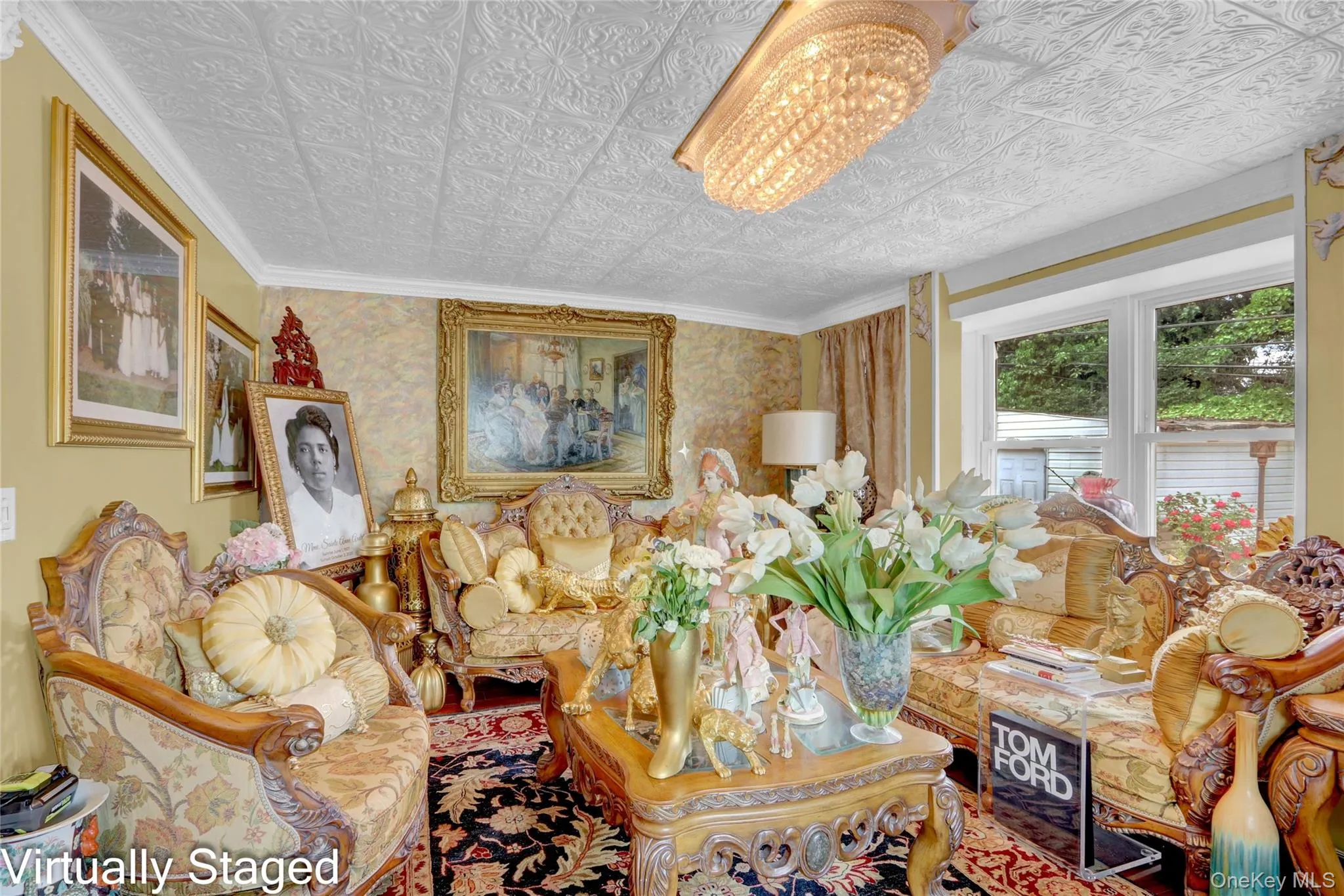 Sitting room with an ornate ceiling, wallpapered walls, and ornamental molding Sitting room with an ornate ceiling, wallpapered walls, and ornamental molding