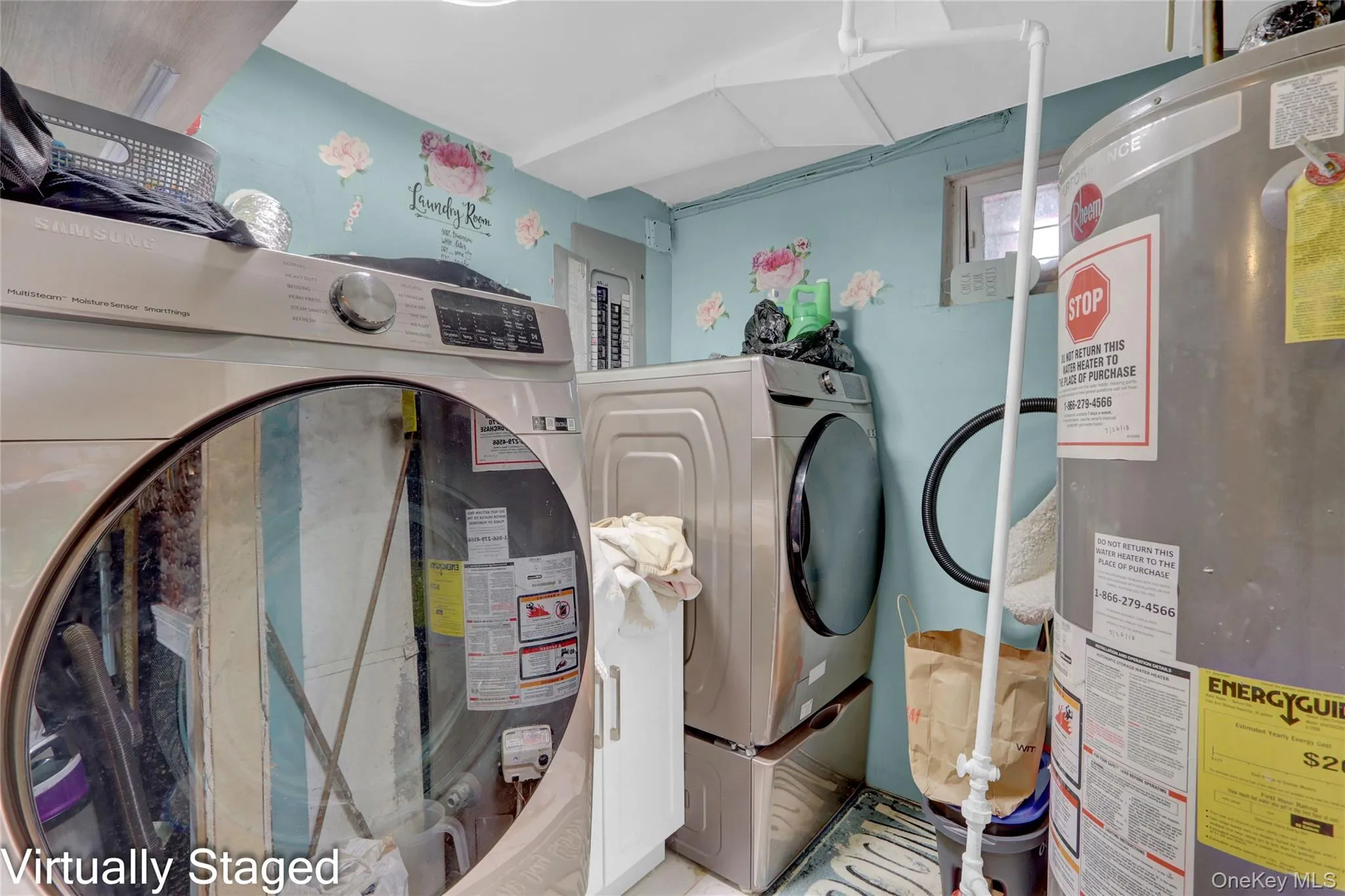 Laundry room featuring gas water heater and electric panel Laundry room featuring gas water heater and electric panel