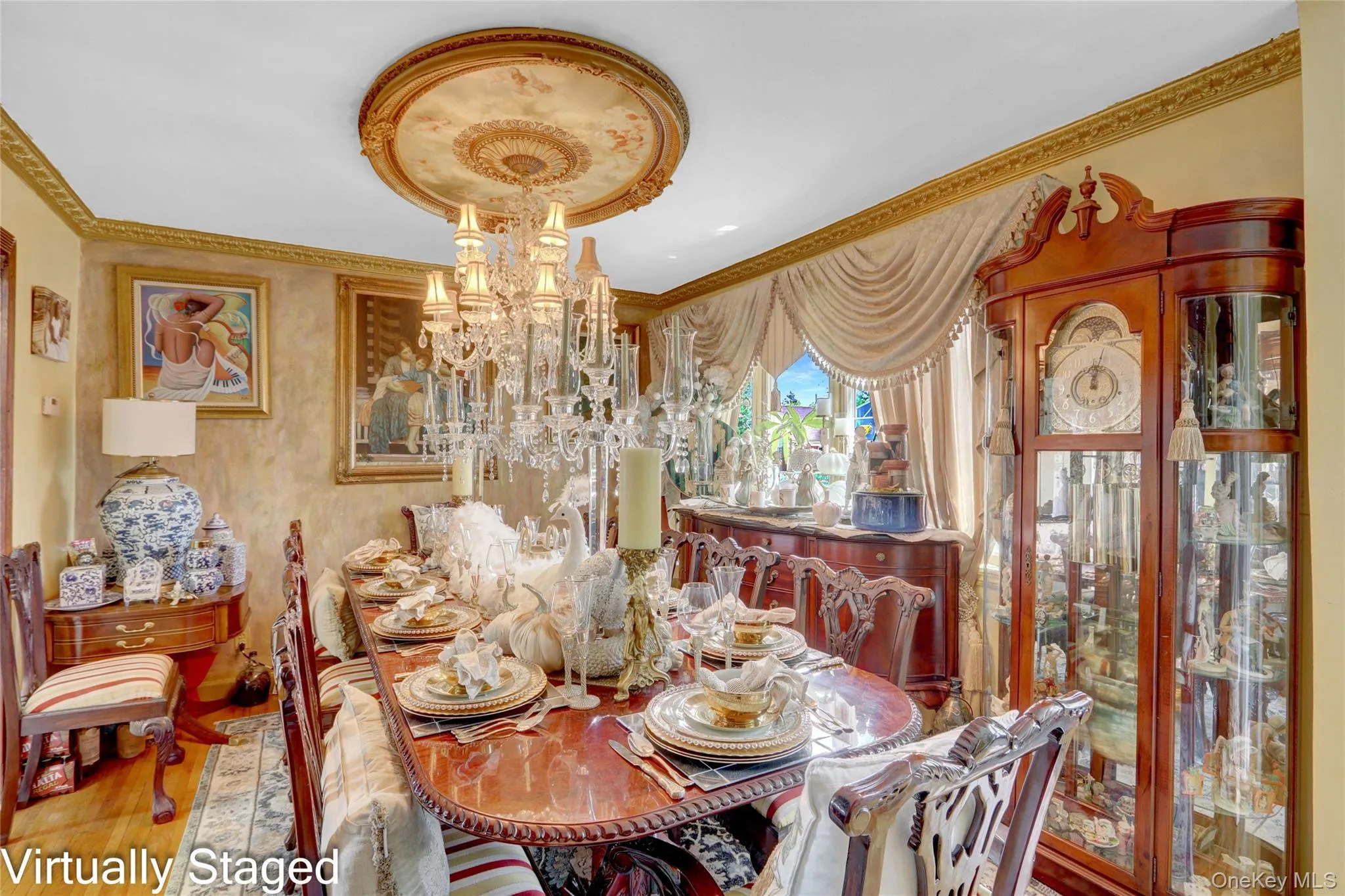 Dining area featuring a chandelier, ornamental molding, and wood finished floors Dining area featuring a chandelier, ornamental molding, and wood finished floors