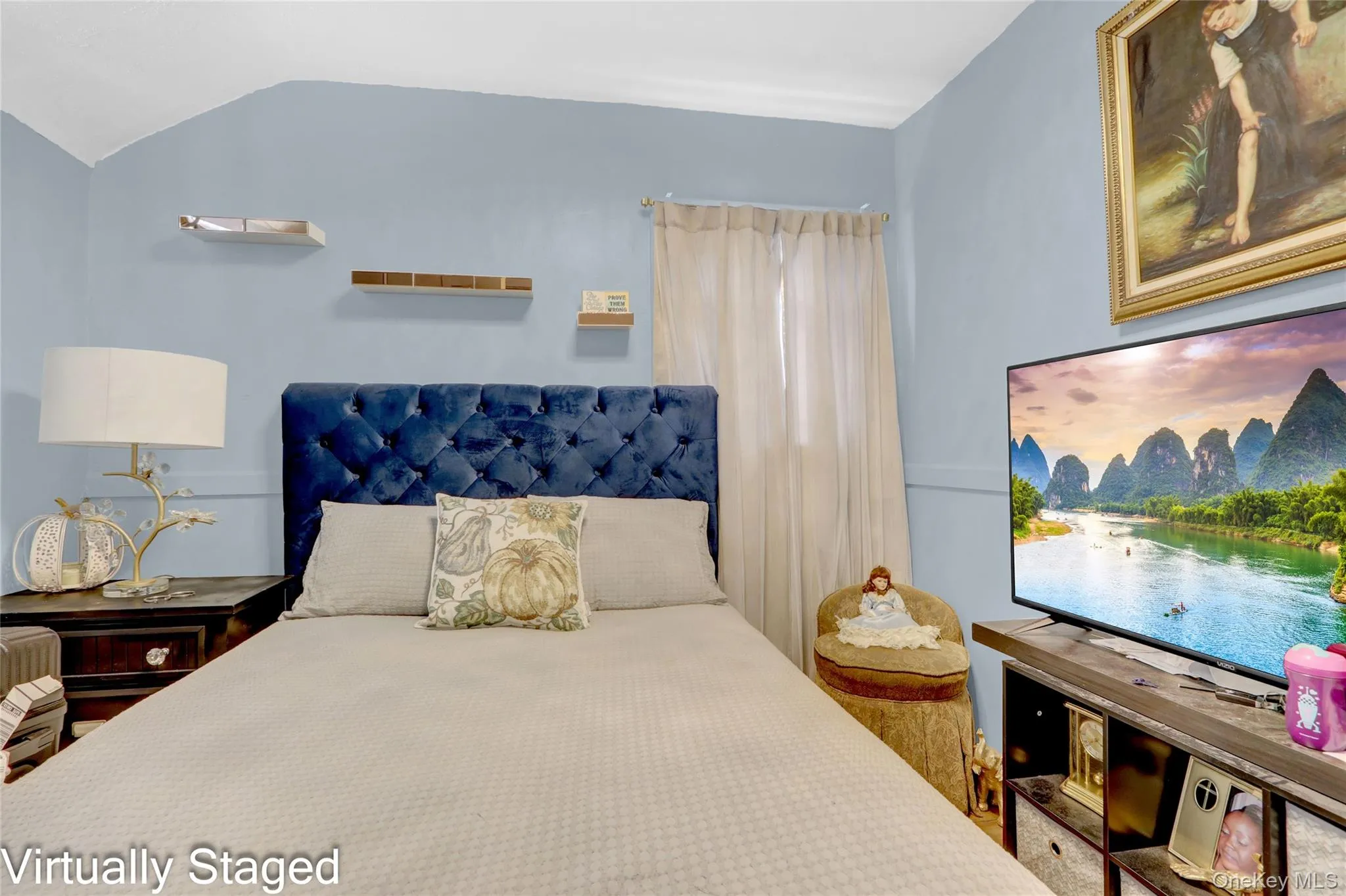 Bedroom featuring vaulted ceiling Bedroom featuring vaulted ceiling