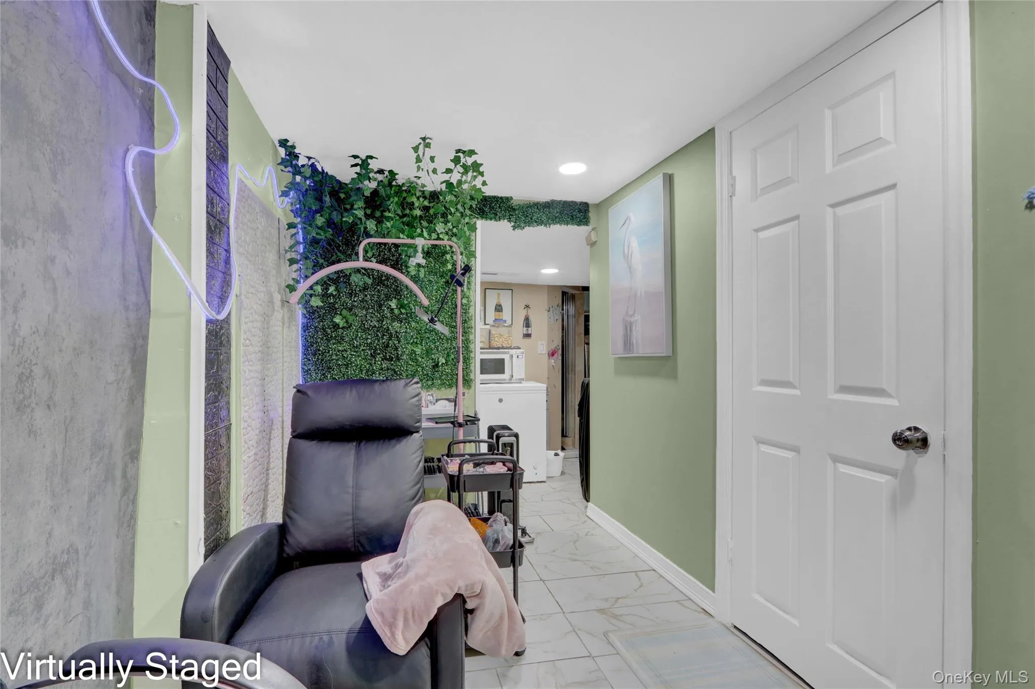 Hall featuring recessed lighting and light marble finish floors Hall featuring recessed lighting and light marble finish floors