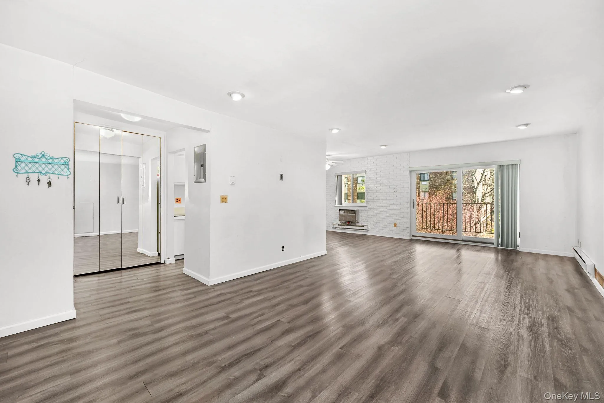 The property features light wood flooring throughout, white walls, and recessed lighting The property features light wood flooring throughout, white walls, and recessed lighting