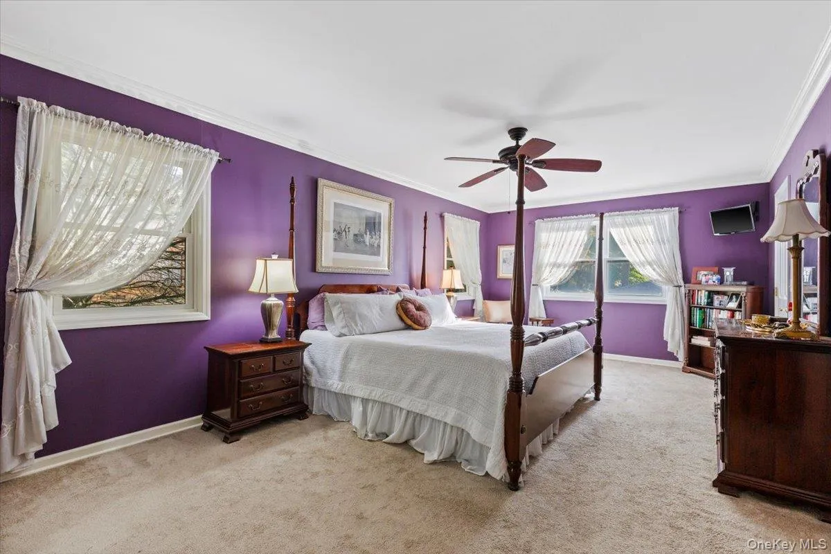 Large primary bedroom with dual walk in closets and en suite bathroom Large primary bedroom with dual walk in closets and en suite bathroom