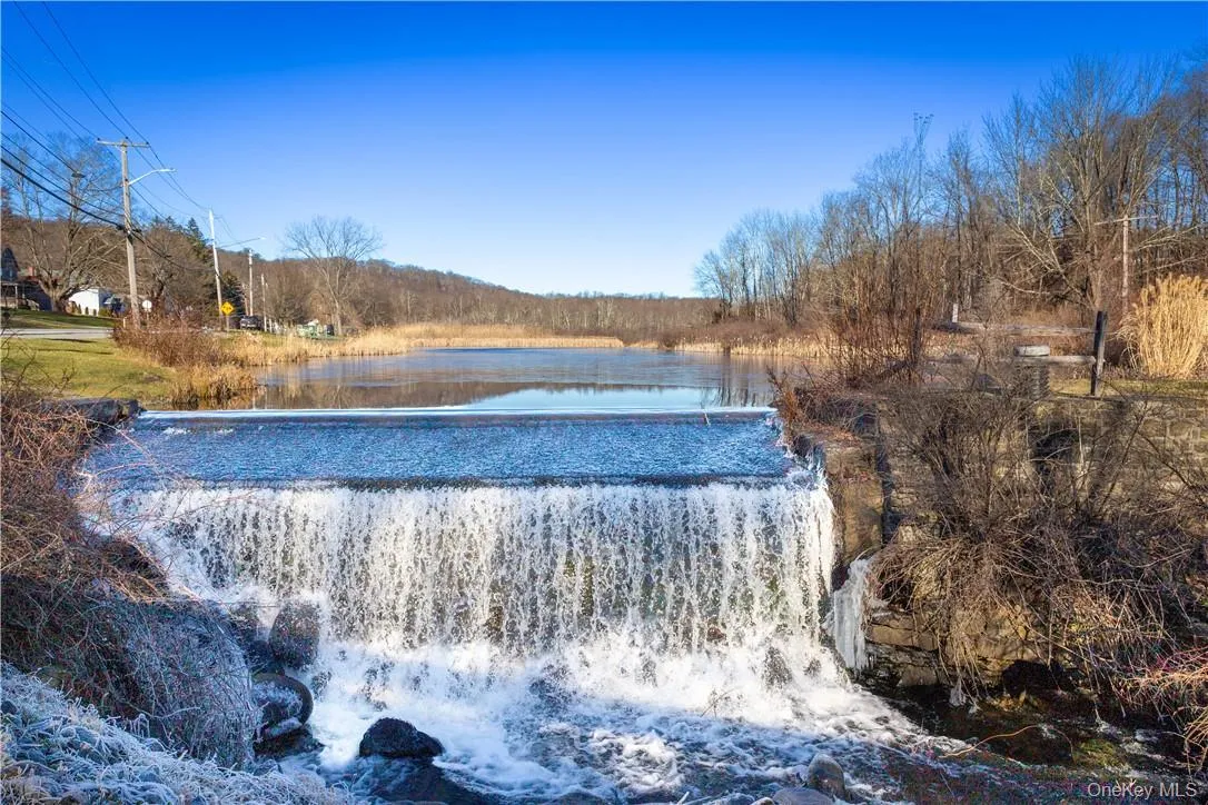Scenic pond and dam with spillway, also across the street. Scenic pond and dam with spillway, also across the street.