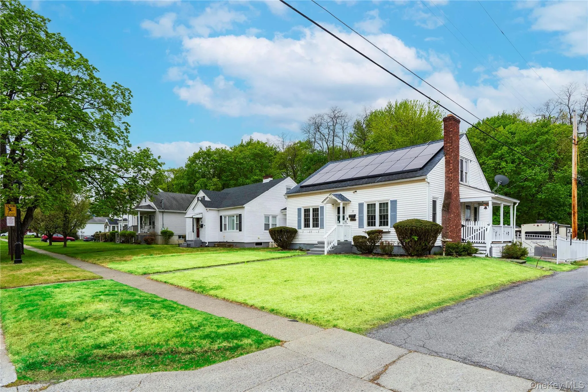 Tree Lined Street with Street Lamps and Sidewalks. Side Service Road to a few neighbors Tree Lined Street with Street Lamps and Sidewalks. Side Service Road to a few neighbors
