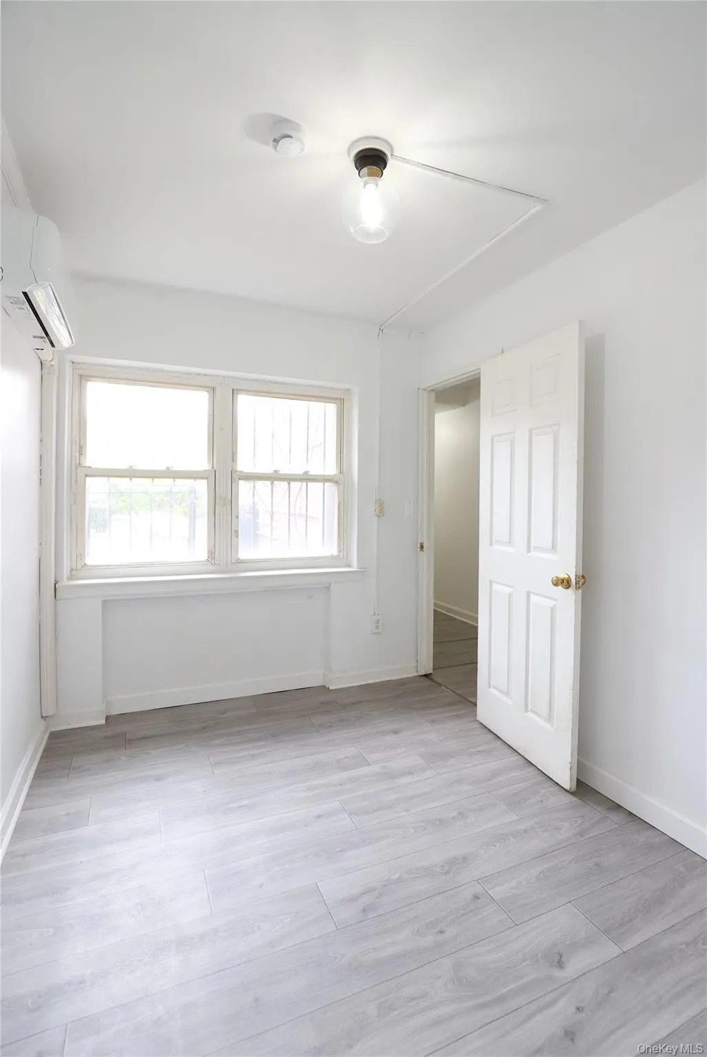 Spare room featuring light wood-type flooring and a mini split for heating / cooling Spare room featuring light wood-type flooring and a mini split for heating / cooling